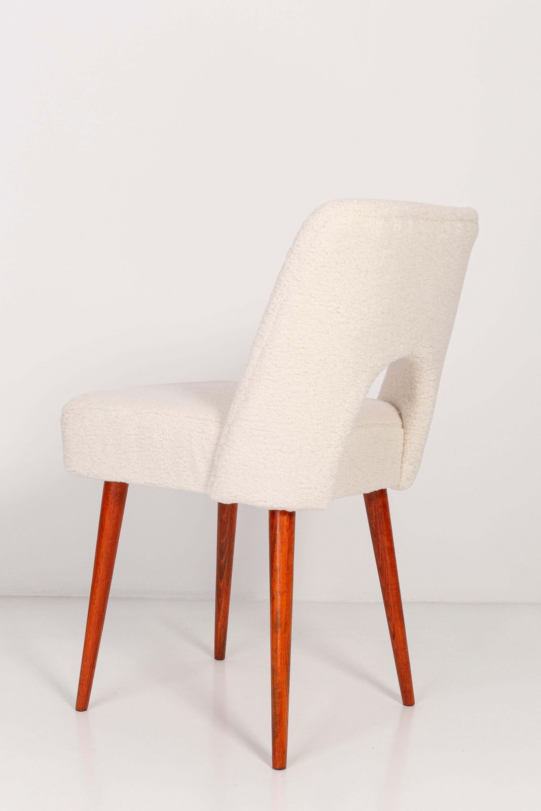 photo for sale Set Of Twelve Light Crème Boucle 'Shell' Chairs, 1960s