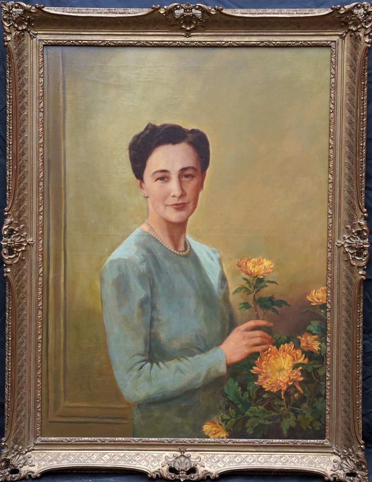 Portrait Of A Lady Arranging Flowers   British 1940's Art Oil Paintingcirca 1940