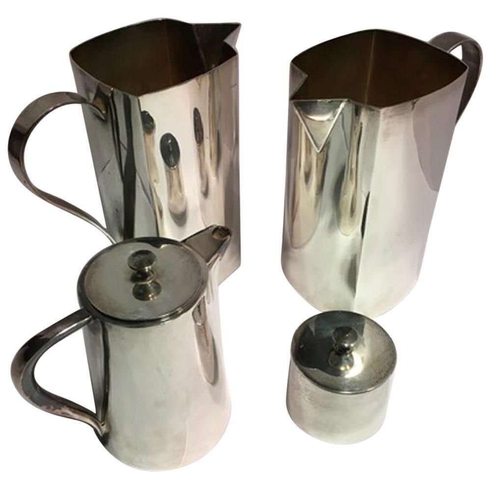 Set Of Four Pieces Pair Silver Plate Water Carafes Coffee Pot And Sugar Bowl