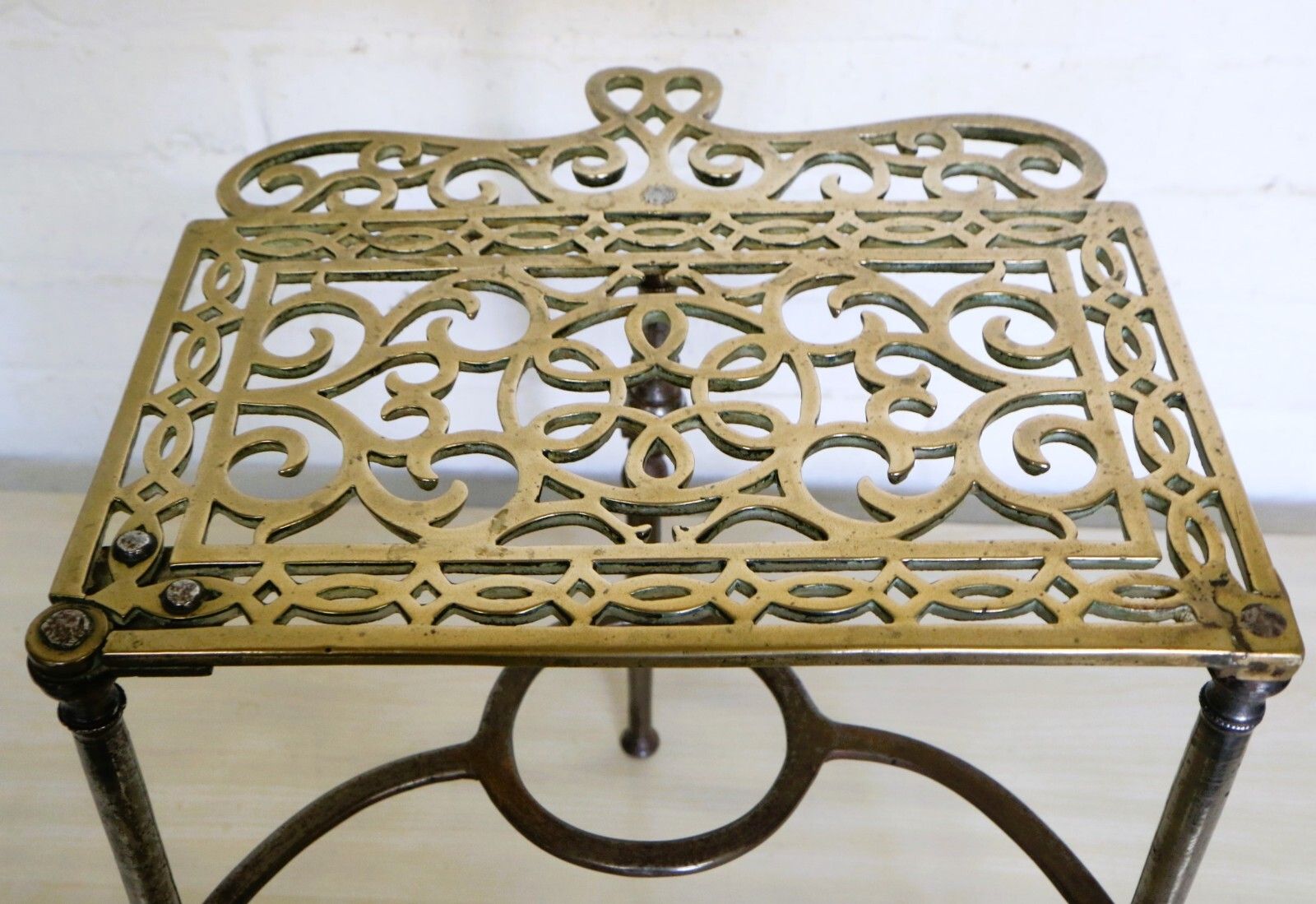 photo vintage Antique Brass Footman Trivet Mid 19th Century Decorative Wrought Iron Base