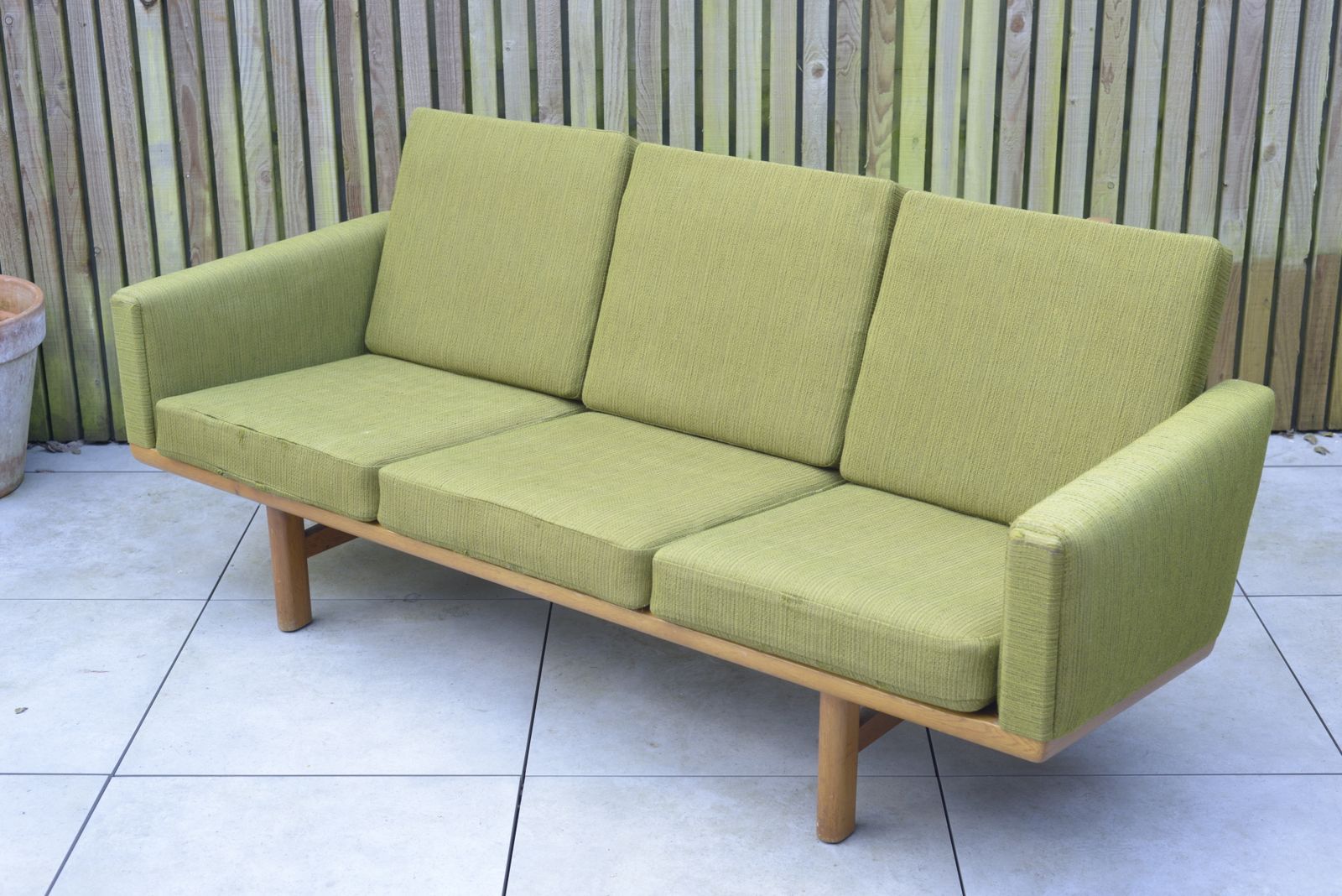 Hans Wegner, Ge236 Getama Sofa. In Oak And Green Wool Upholstery. Danish, 1950s.