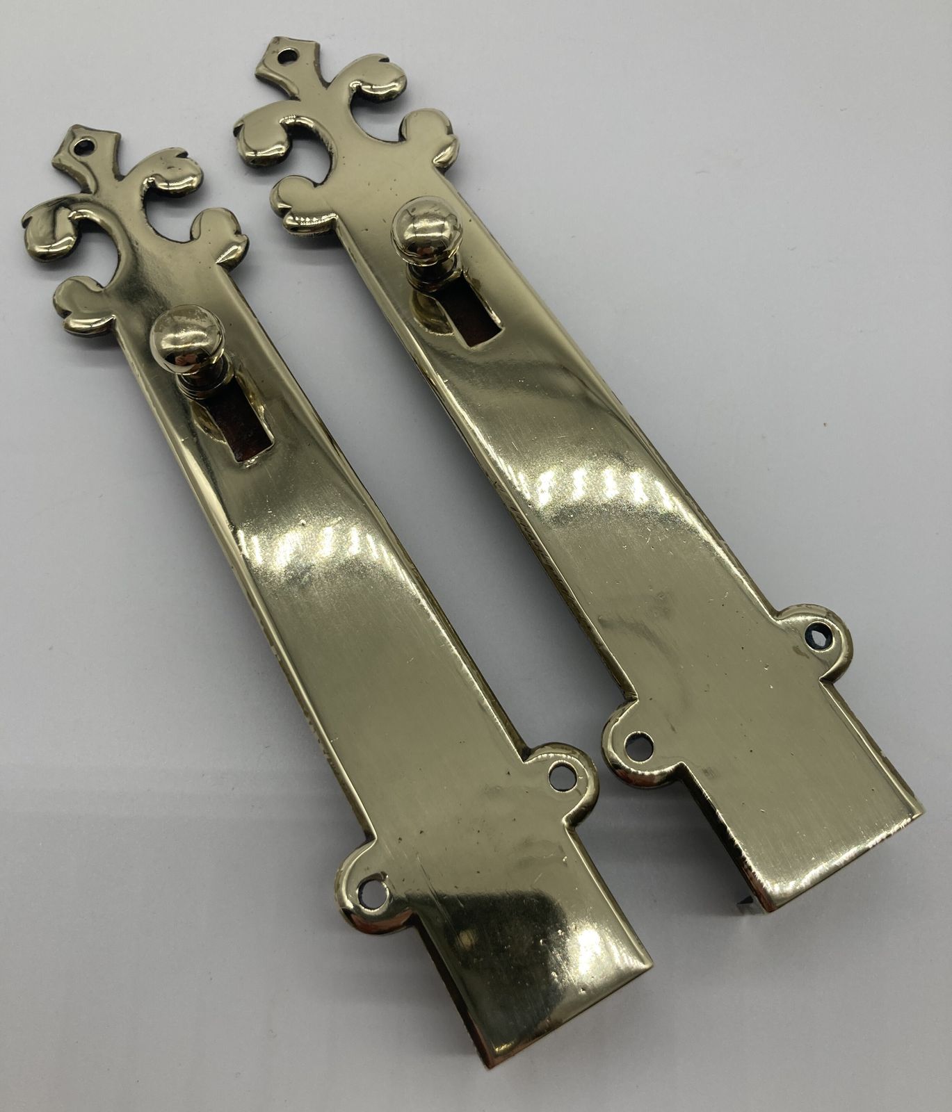 A Pair Of Small Brass Door Shut Bolts photo furniture