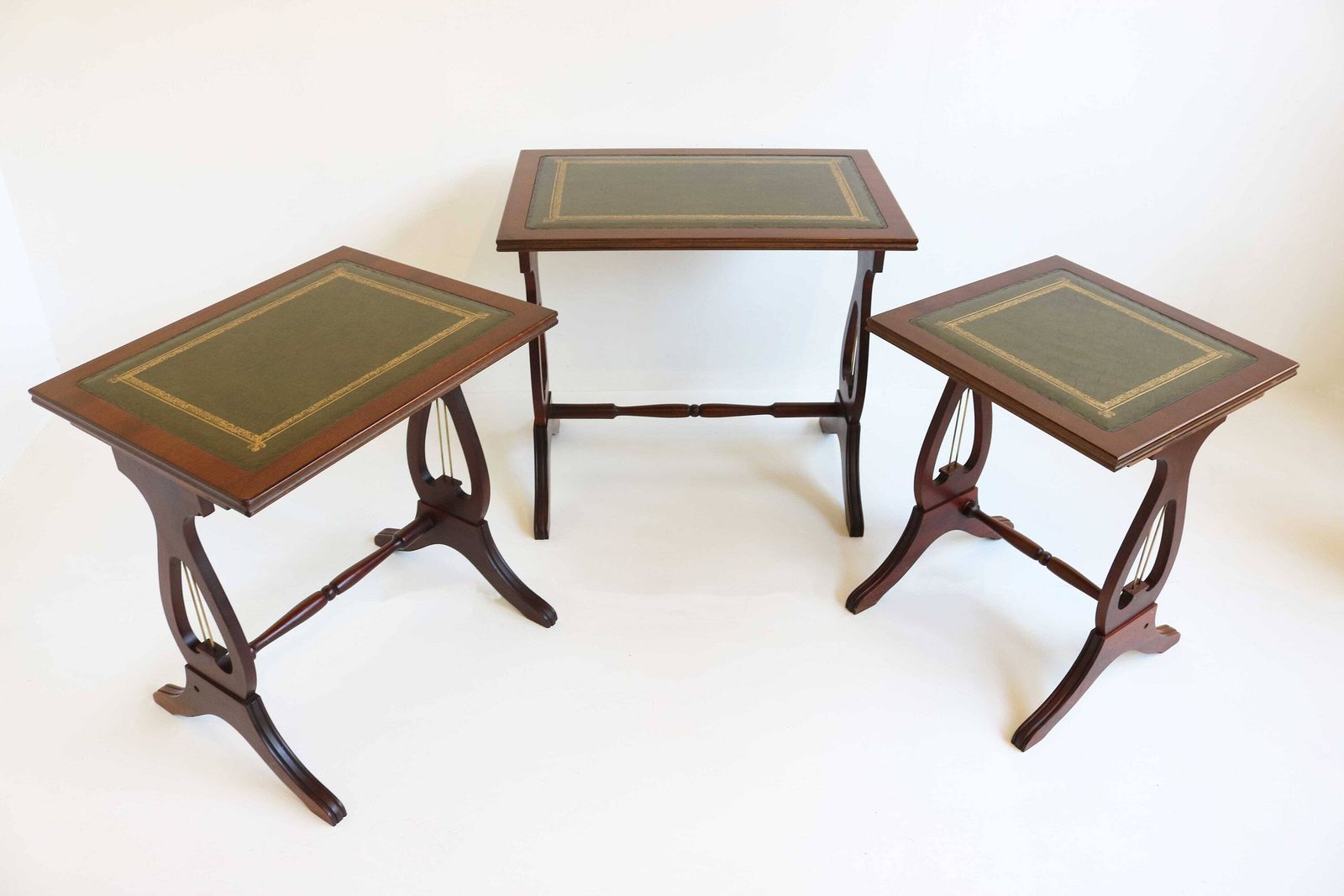 Mid Century Wooden Nesting Tables With Green Leather Tops Harp Shaped Legs Set Of Three Sides Tables Antique Style Nest Of Tables Mimiset 70 photo buy