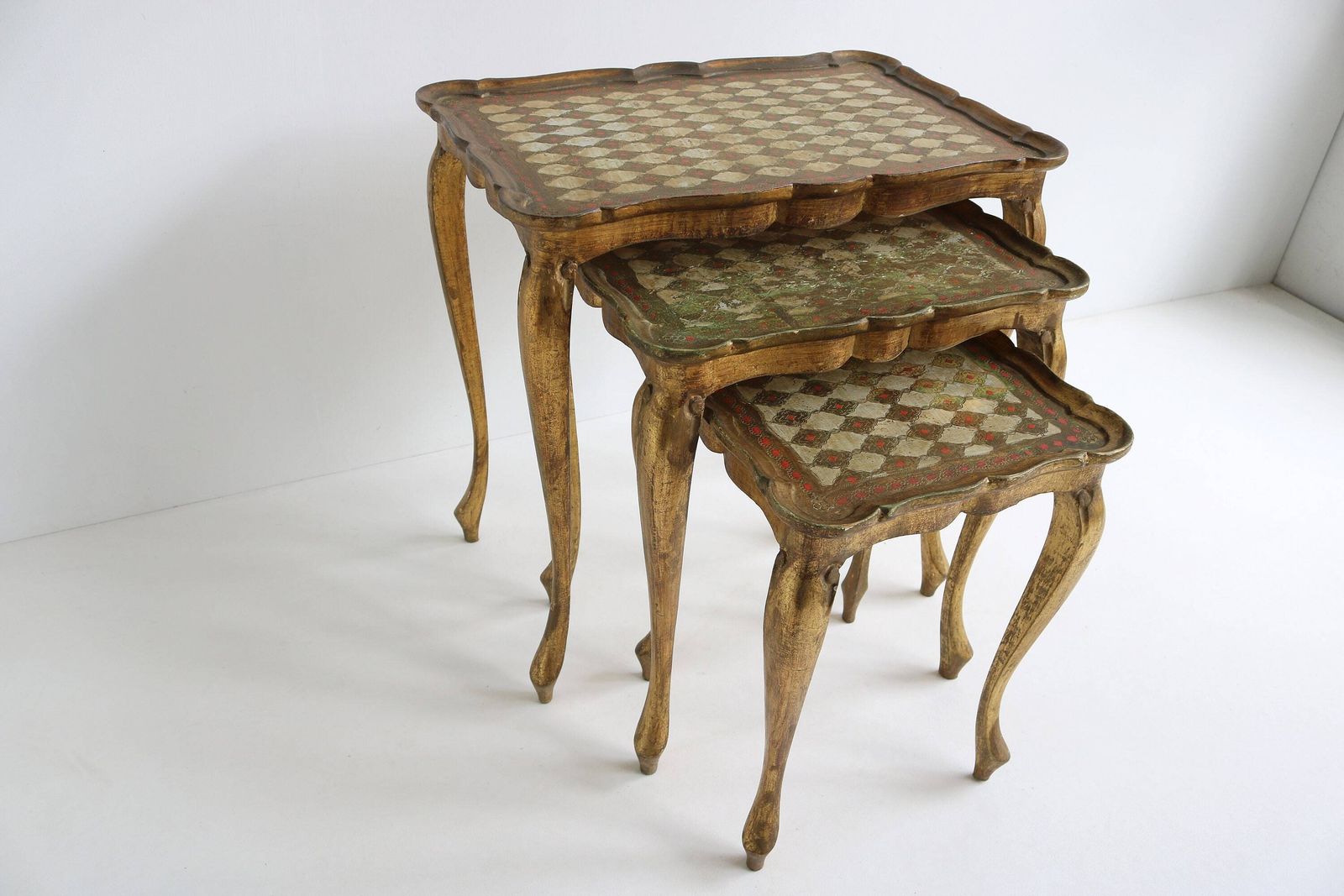 Graceful Set Of Three Italian Florentine Gold Hollywood Regency Wood Stacking Nesting Tables Additional Tables Side Tables Set Tables 1960s photo furniture