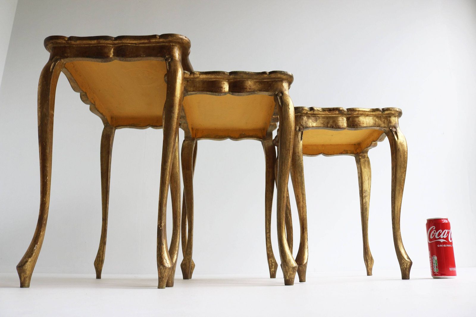 photo furniture Graceful Set Of Three Italian Florentine Gold Hollywood Regency Wood Stacking Nesting Tables Additional Tables Side Tables Set Tables 1960s
