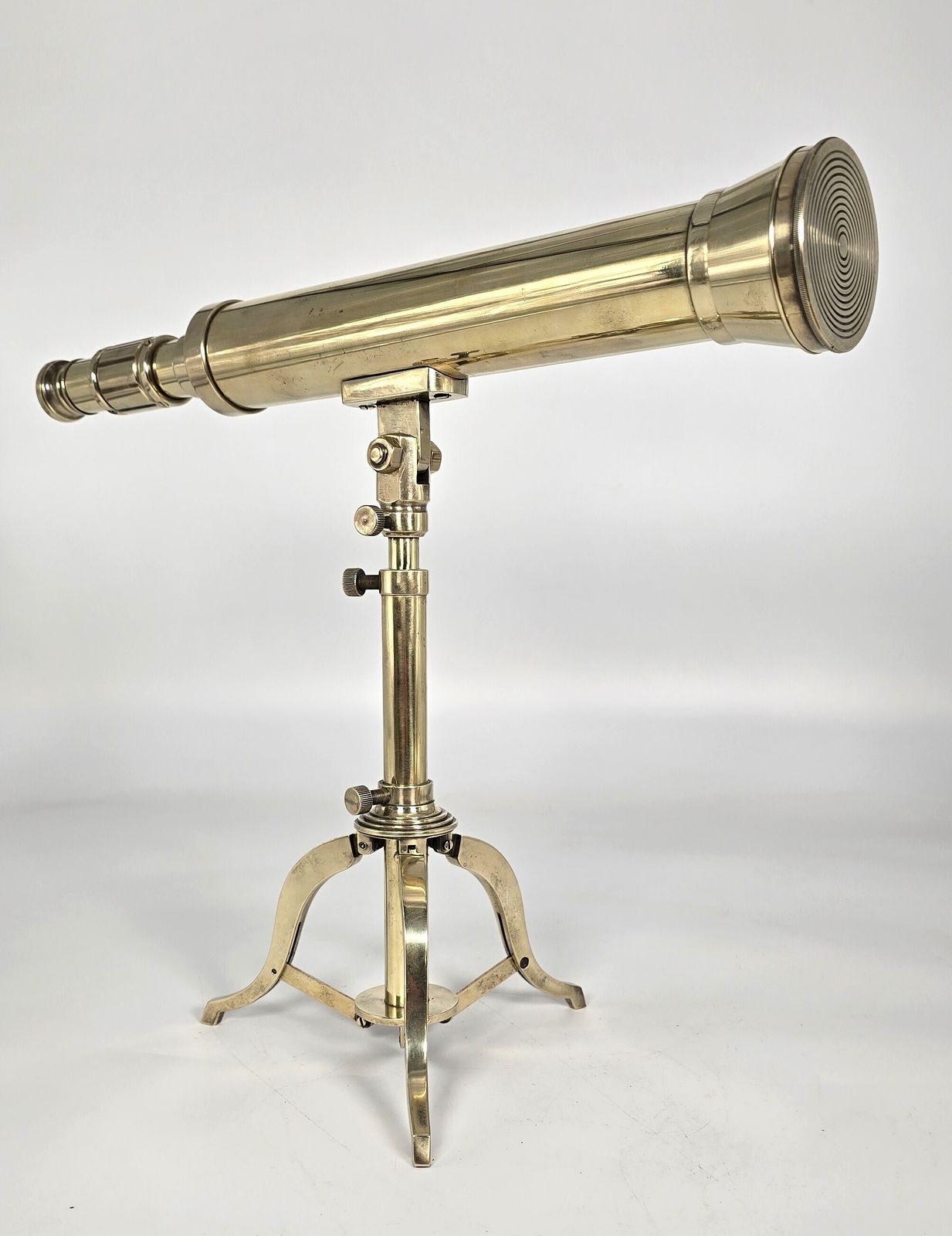 A Small Mid 19th Century Brass Telescope With An Original Folding Brass Tripod Stand.