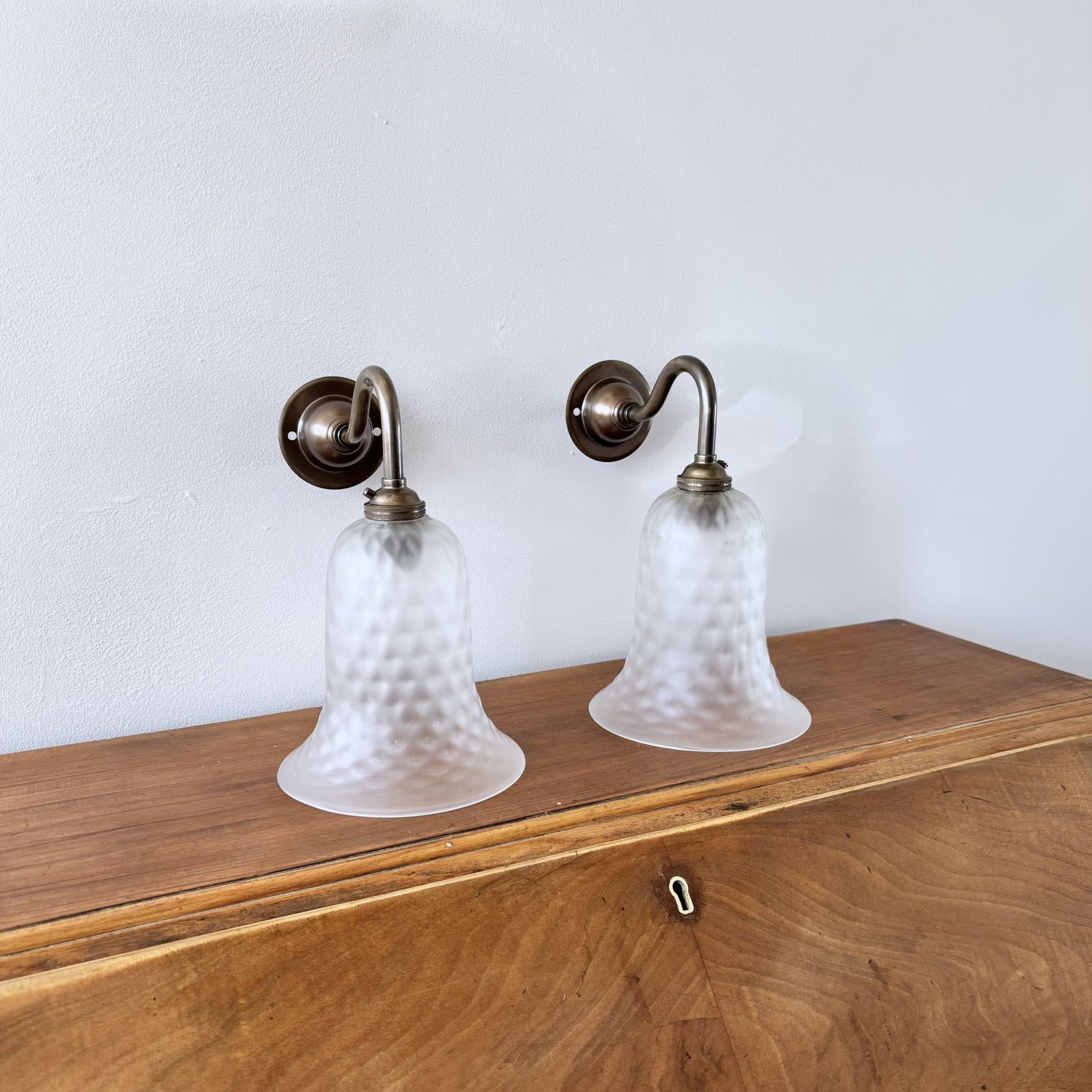 Pair Of Frosted Bell Glass Shade Wall Lights In Antique Brass photo for sale