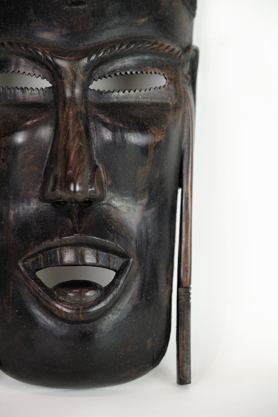 African Mask Hand Carved In Dark Wood photo for sale