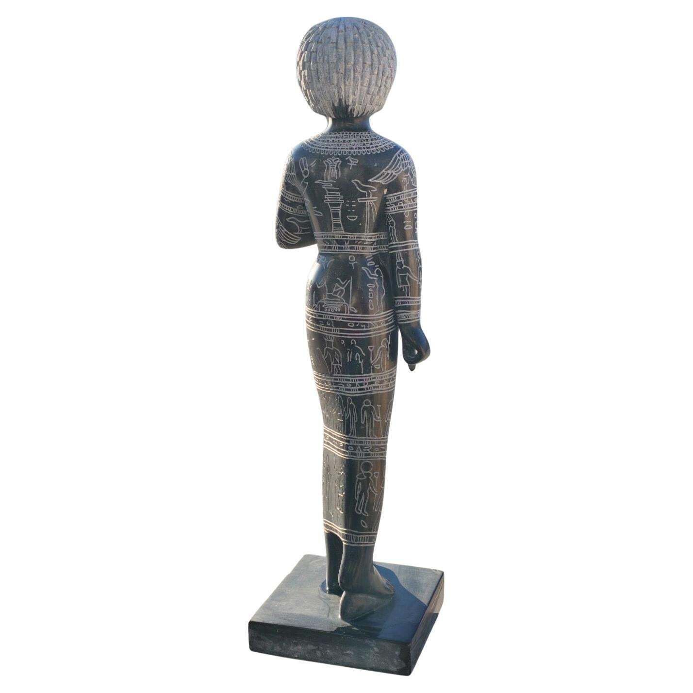 Black Marble Female Sculpture With Engraved Egyptian Hieroglyphs On Marble Base photo Art