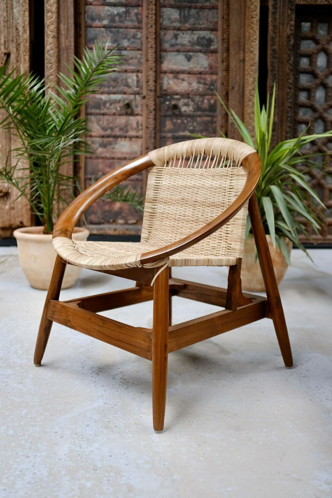 Handcrafted Teakwood & Cane Lounge Chair – Sculptural Curved Frame, Woven Seat For Indoor & Outdoor Use