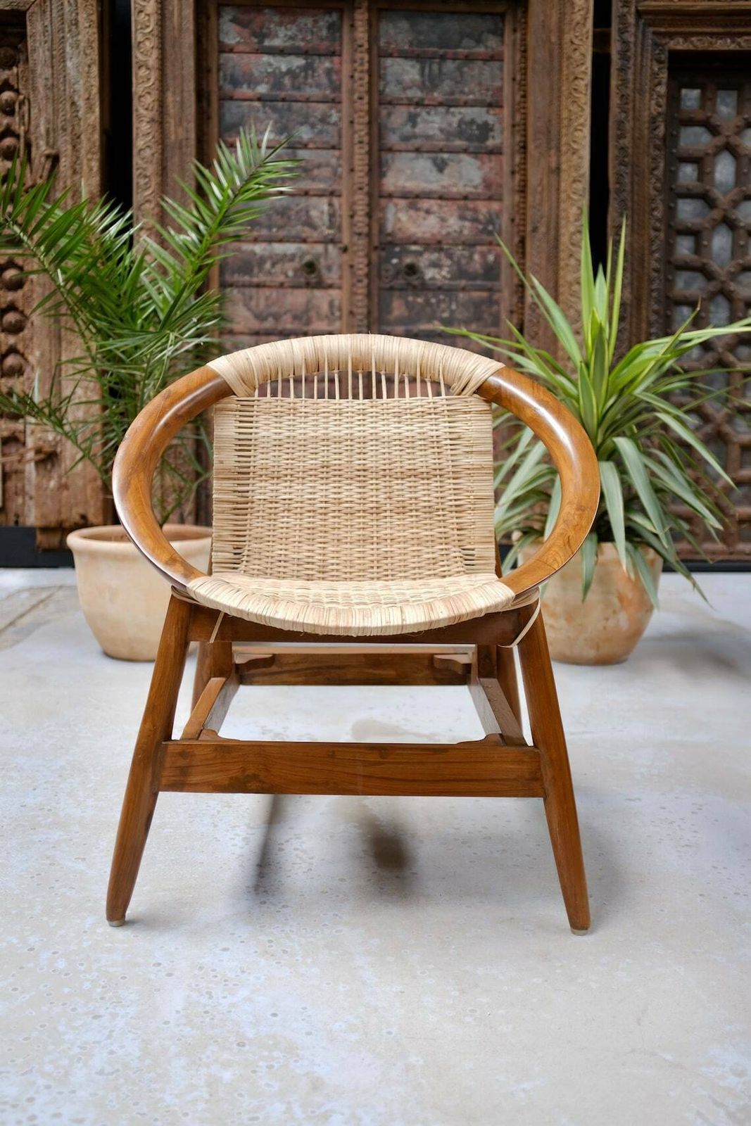 Handcrafted Teakwood & Cane Lounge Chair – Sculptural Curved Frame, Woven Seat For Indoor & Outdoor Use photo for sale
