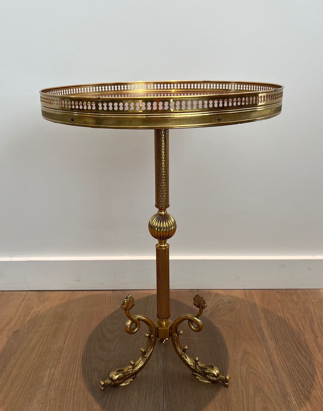 Round Neoclassical Style Brass Pedestal Table With Base Decorated With Dolphins And Red Celluloid Top Surrounded By An Openwork Gallery Attributed To photo for sale