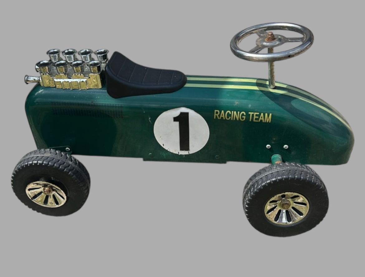 A Vintage Goki Ride On Toy Car photo furniture
