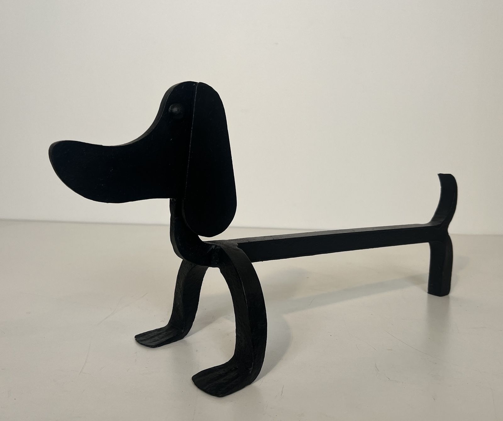 photo furniture Pair Of Wrought Iron Andirons Depicting Dachshunds Attributed To Edouard Schenck