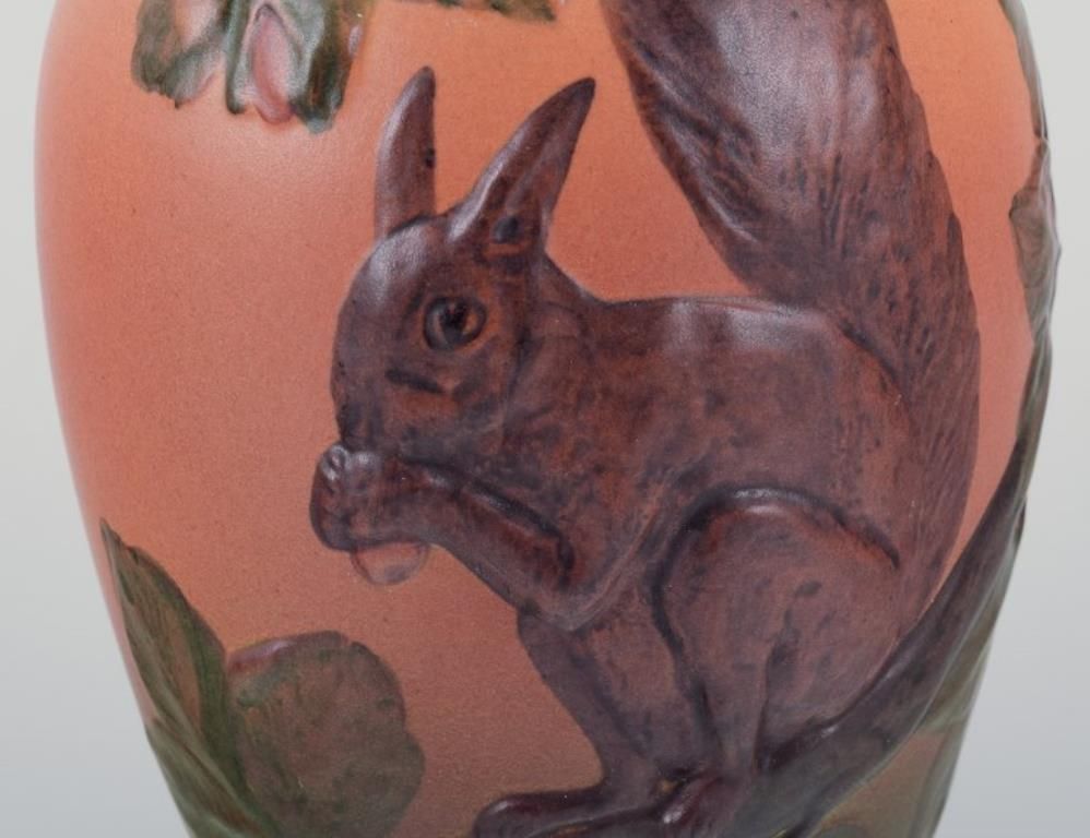 Ipsen's Denmark, Vase With Squirrel, Glazing In Orange And Green Tones. photo for sale