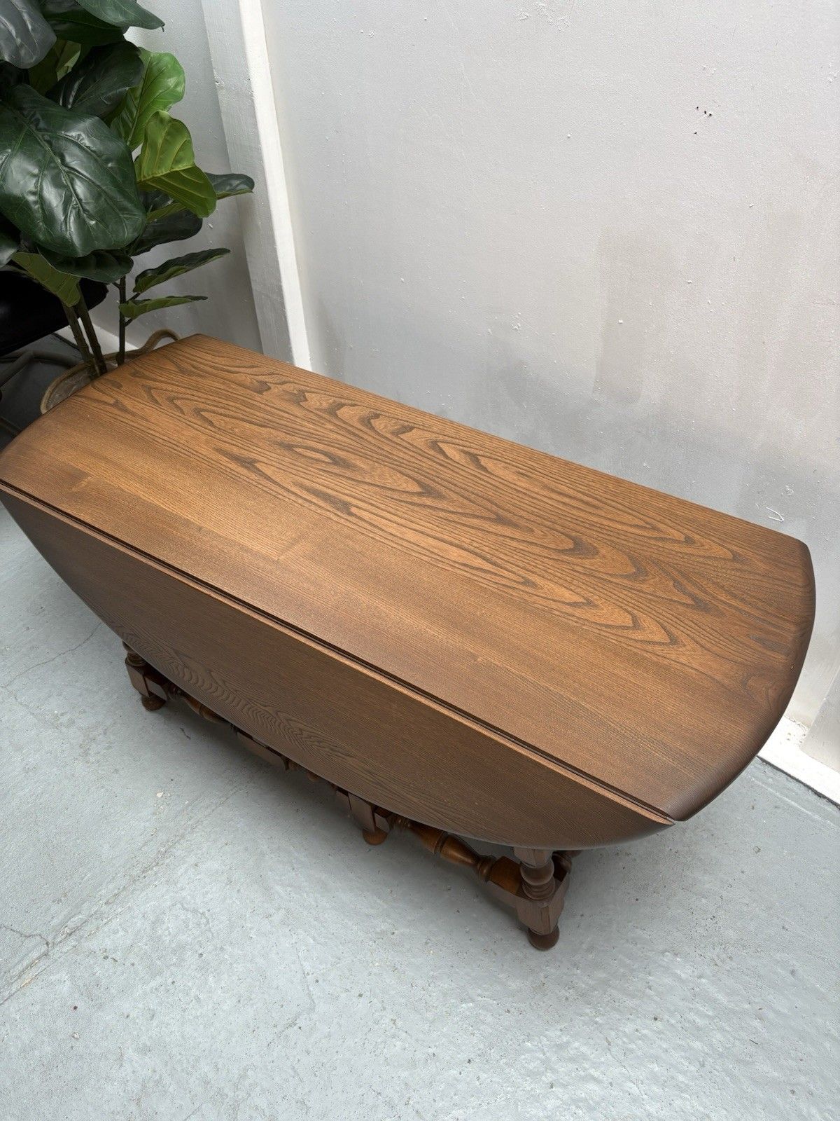 Ercol Trinity Solid Elm 2 Tier Drop Leaf Coffee Table In Golden Dawn photo vinterior