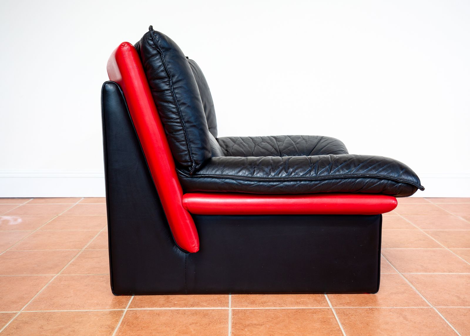 Italian Designer Leather Lounge Chair 1980s Nicoletti Salotti For Avanti Ambassador Chair Postmodern Memphis Style Two Tone Black Leather Red Leather photo vintage