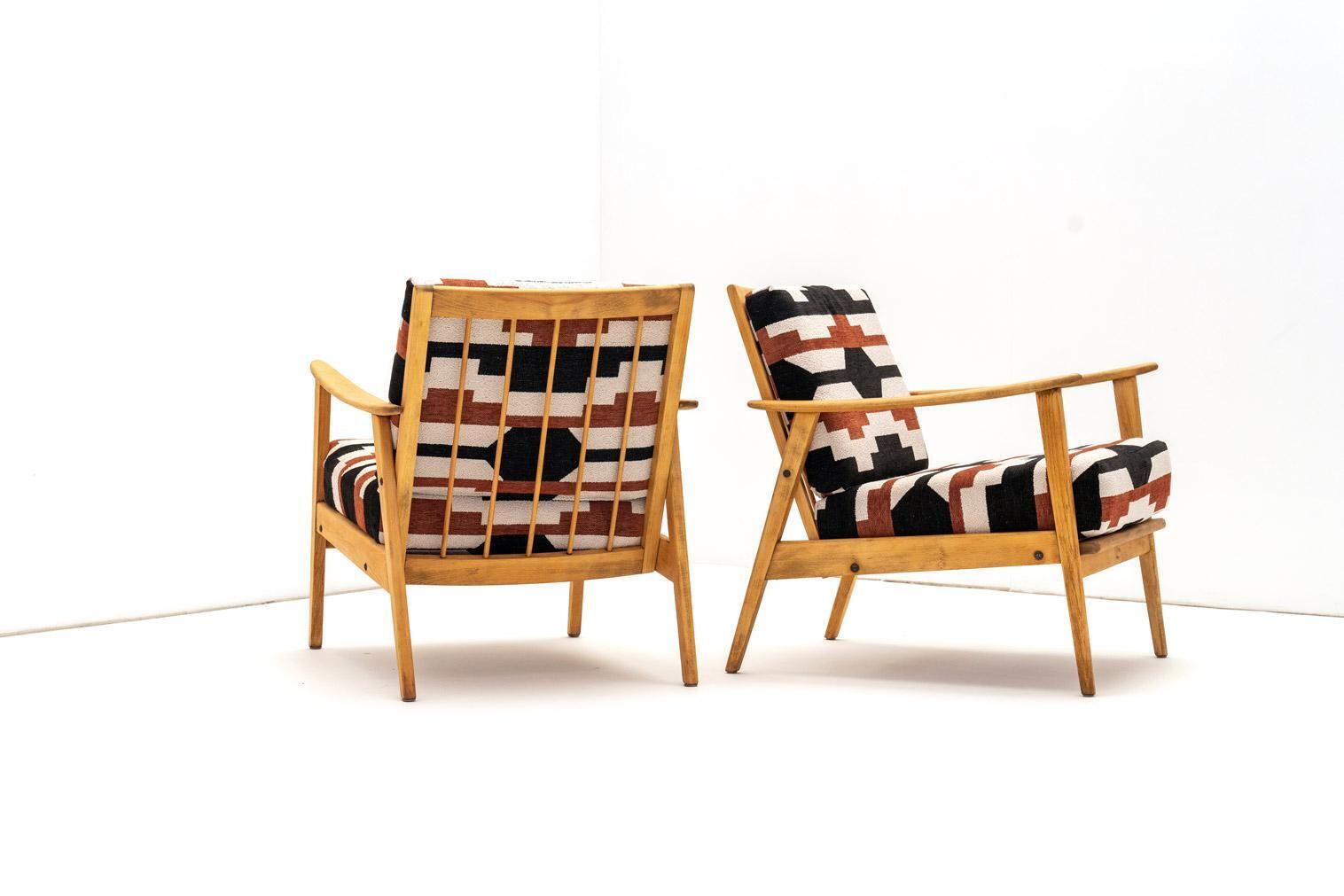 Pair Of Armchairs In Bold Geometric Reupholstery photo furniture