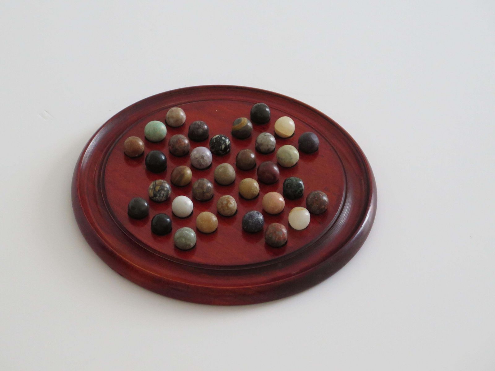 Marble Solitaire Game With Hardwood Board And 33 Agate Stone Marbles, Circa 1925 photo for sale