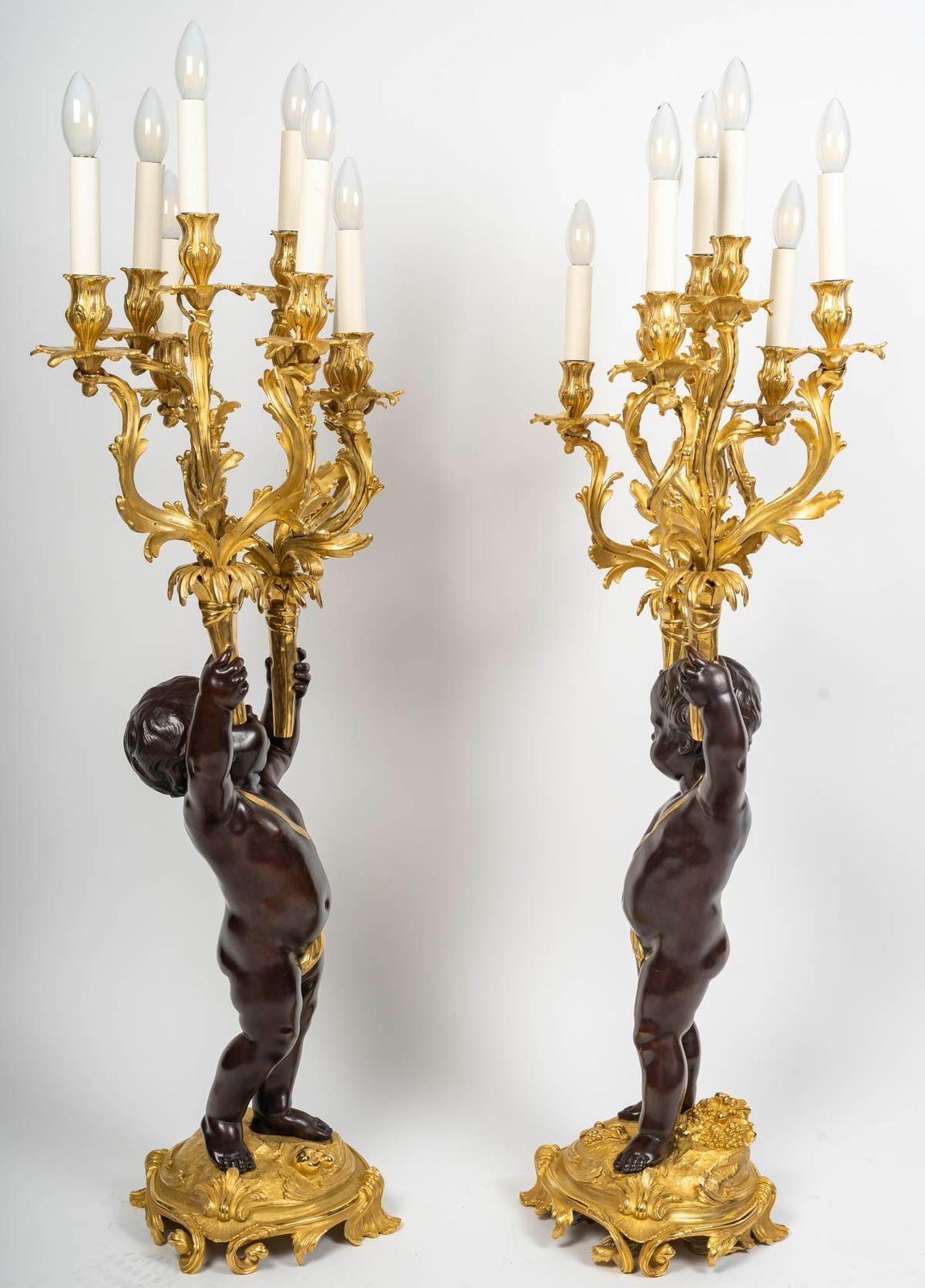photo furniture Large Pair Of Electrified Candelabra In Gilded Bronze With Patina, 19th Century.