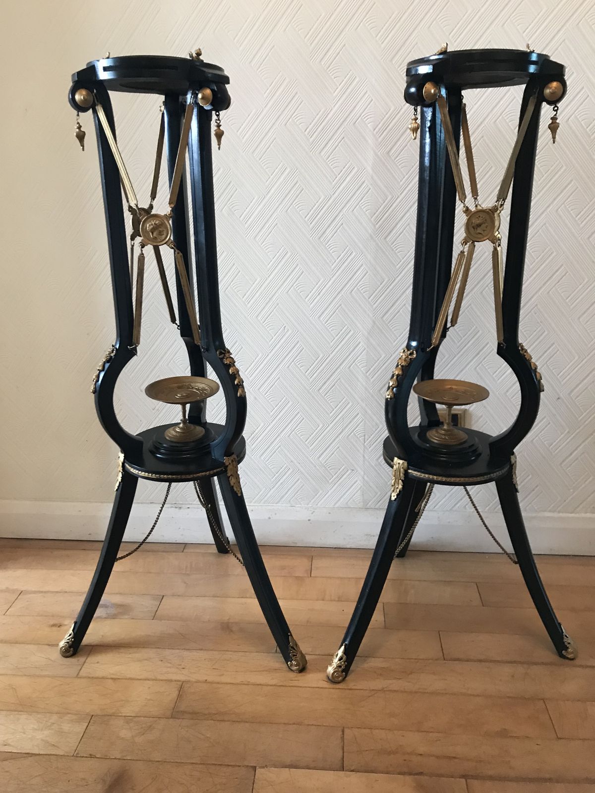 photo vintage Pair Ebonised And Gilt Metal French Empire Style Athenienne Stands With Porcelain Amphora Vases