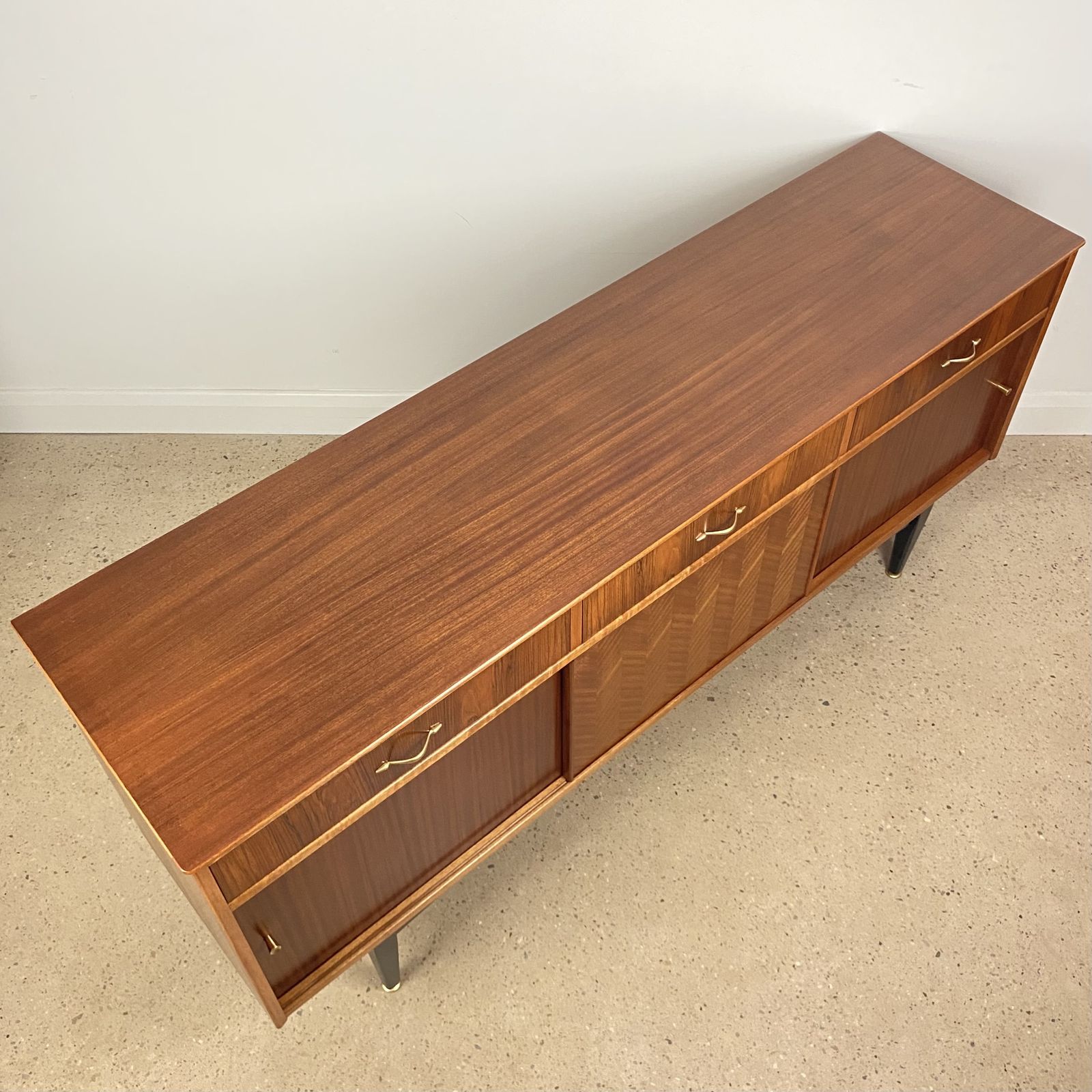 Mid Century Sideboard By Jentique In Teak Rosewood Tola With Black And Gold Chevron Design And Light photo buy