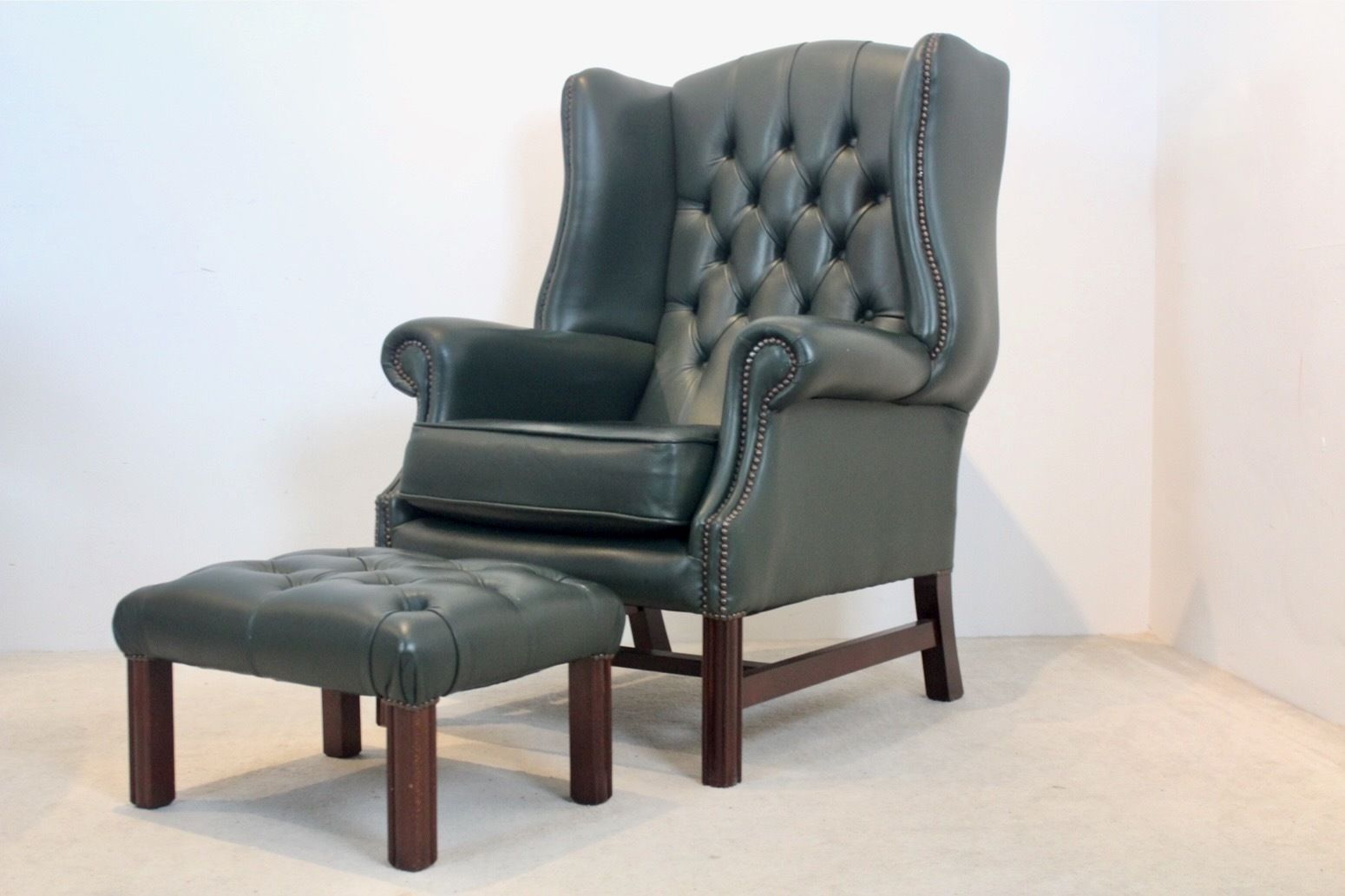 Classic Chesterfield Wingback Armchair With Footstool In Green Leather photo vintage
