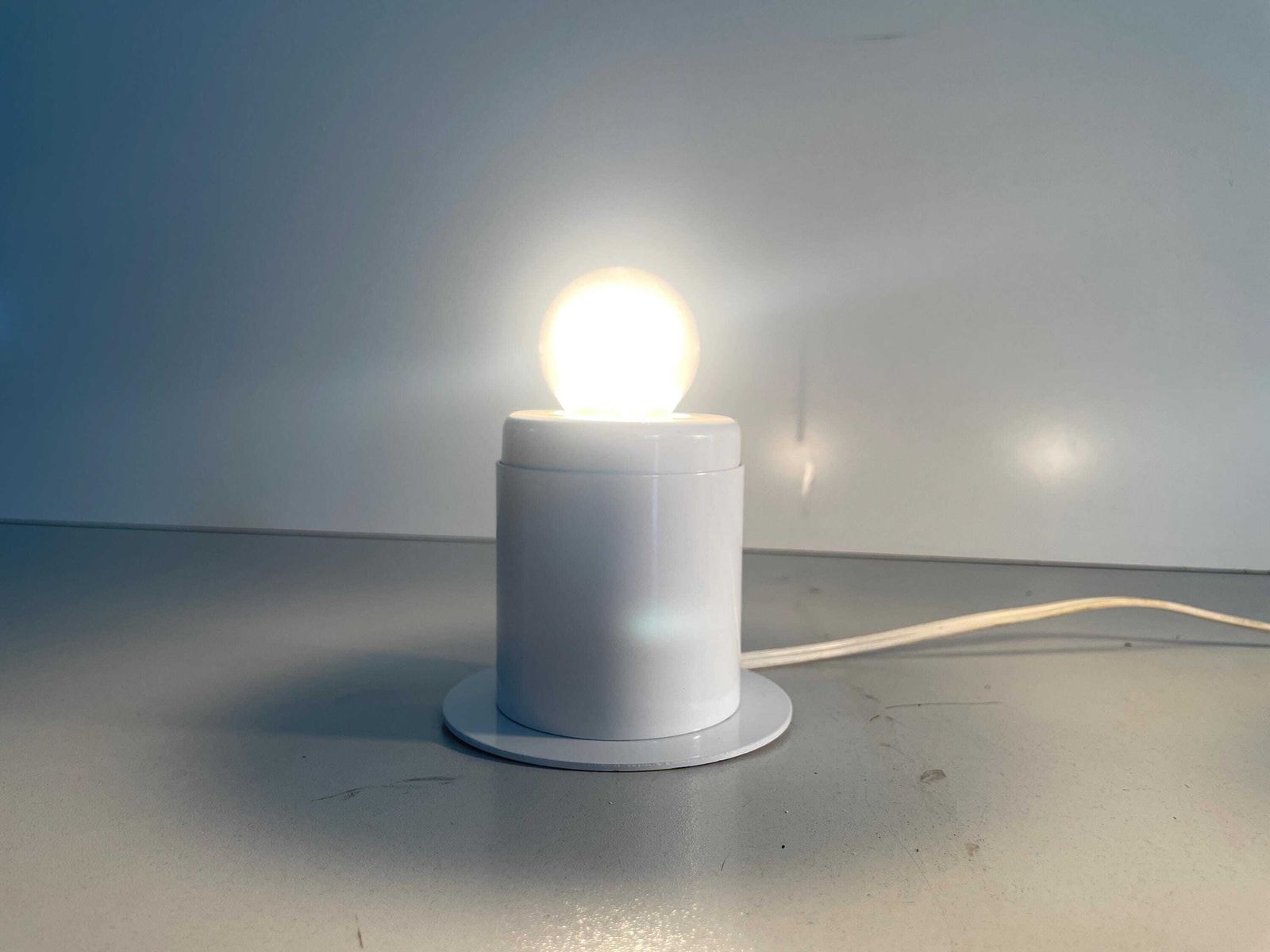 Minimal Design Pair Of White Metal Wall Lamps Still Of Artemide, 1970s, Italy photo for sale