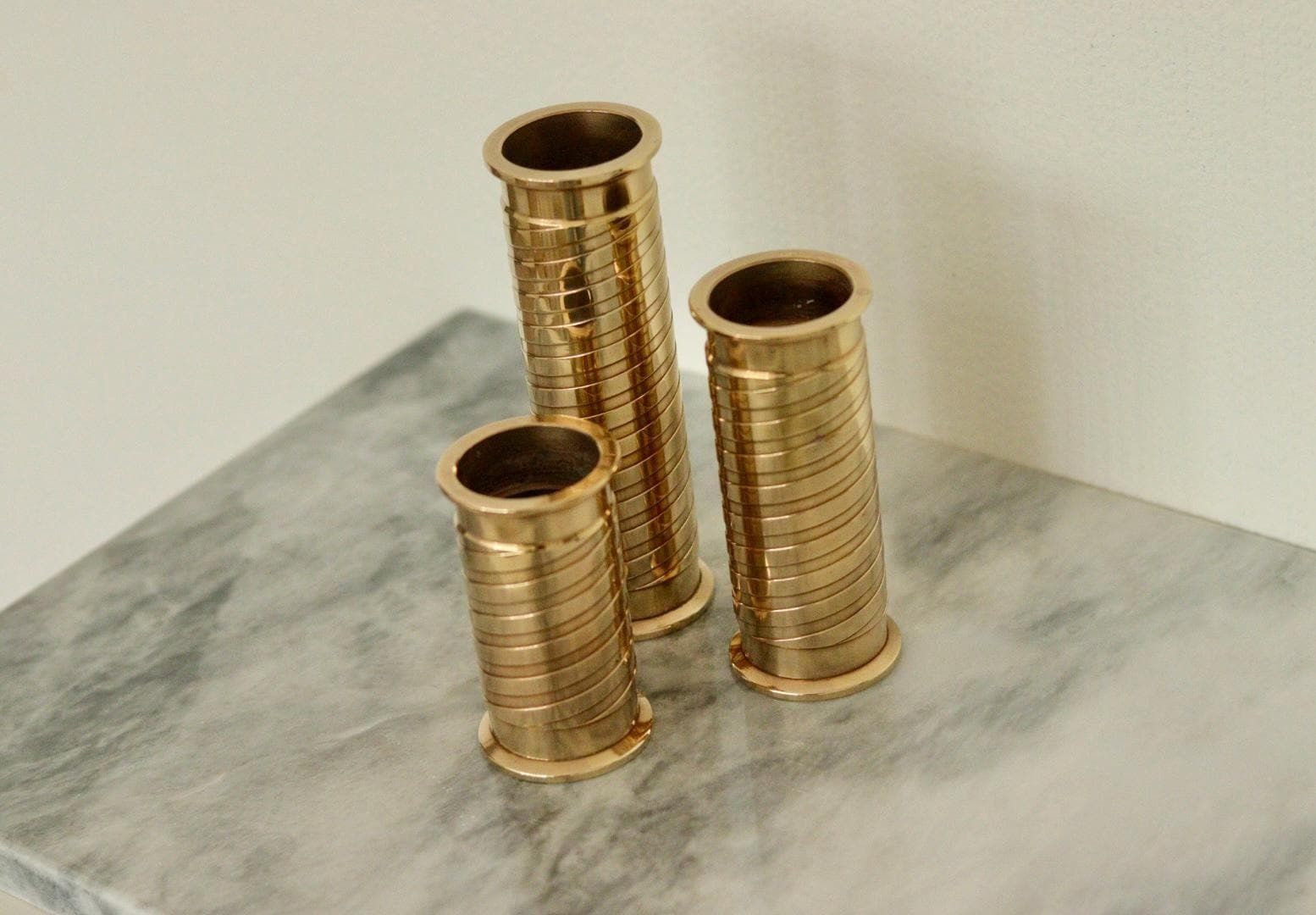 photo furniture Trio Of Mid Century Swedish Brass Candle Holders