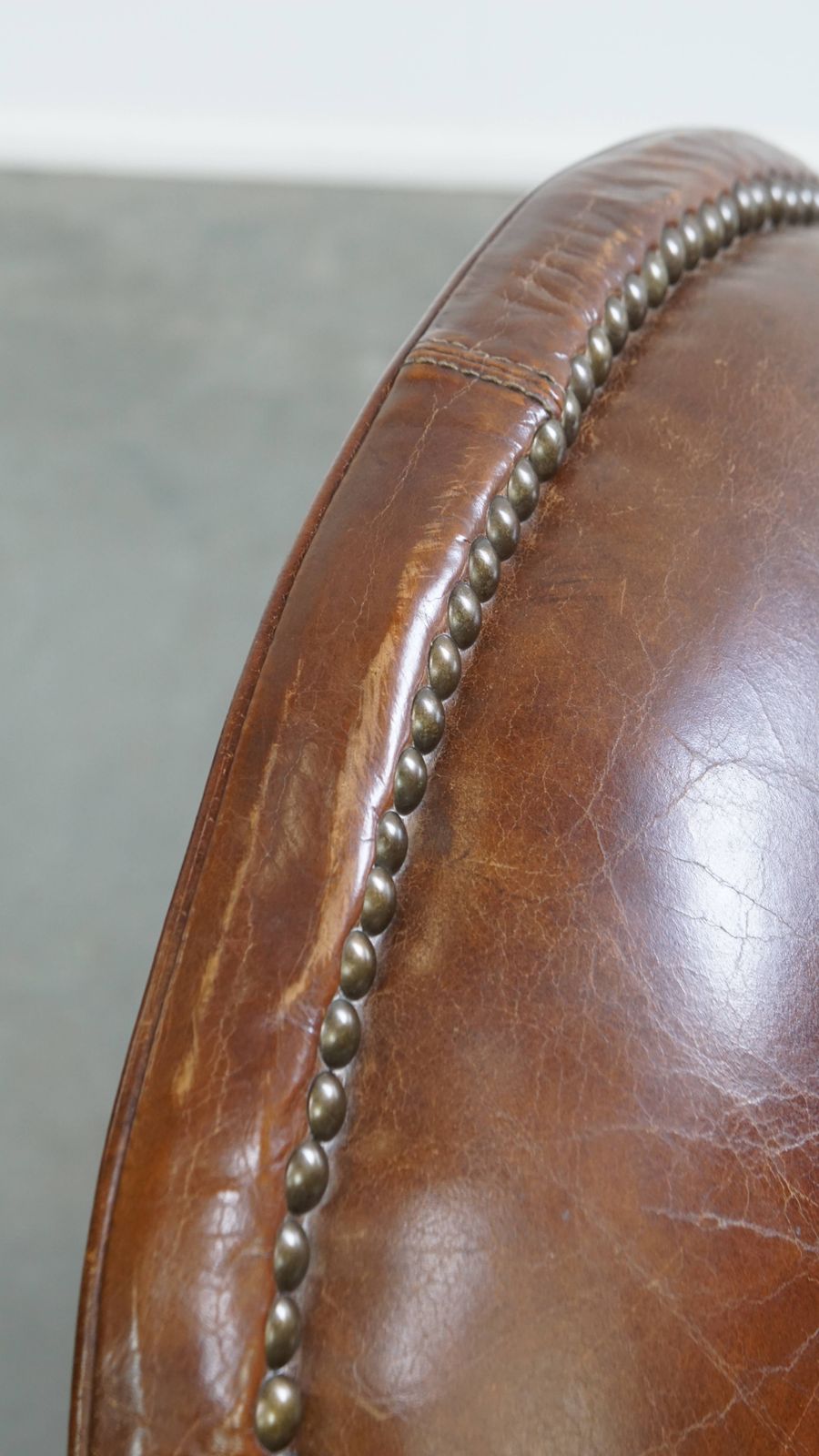 1022.6351999999999 Characterful And Timeless Cowhide Design Armchair With Beautiful Round Shapes And Decorative Nails photo