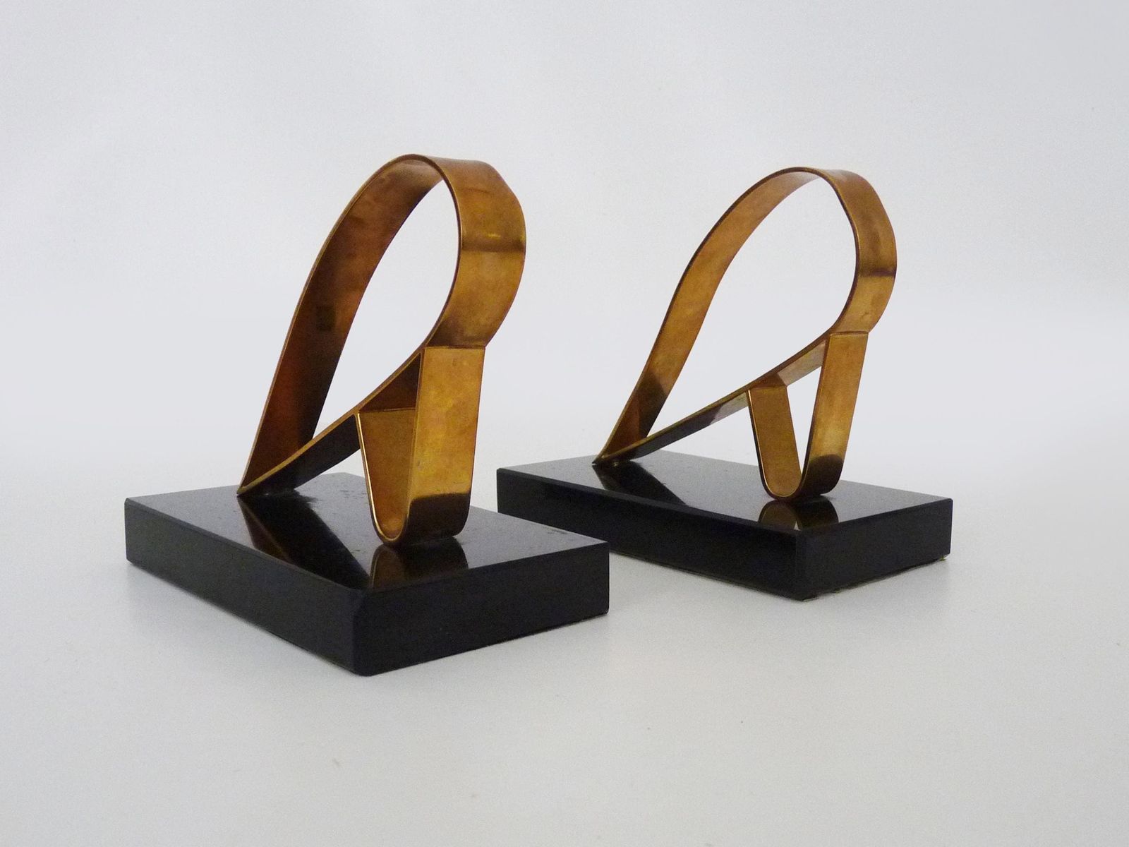 Pair Of Modernist Art Deco Gold Starry Bookends On A Black Marble Base. photo for sale