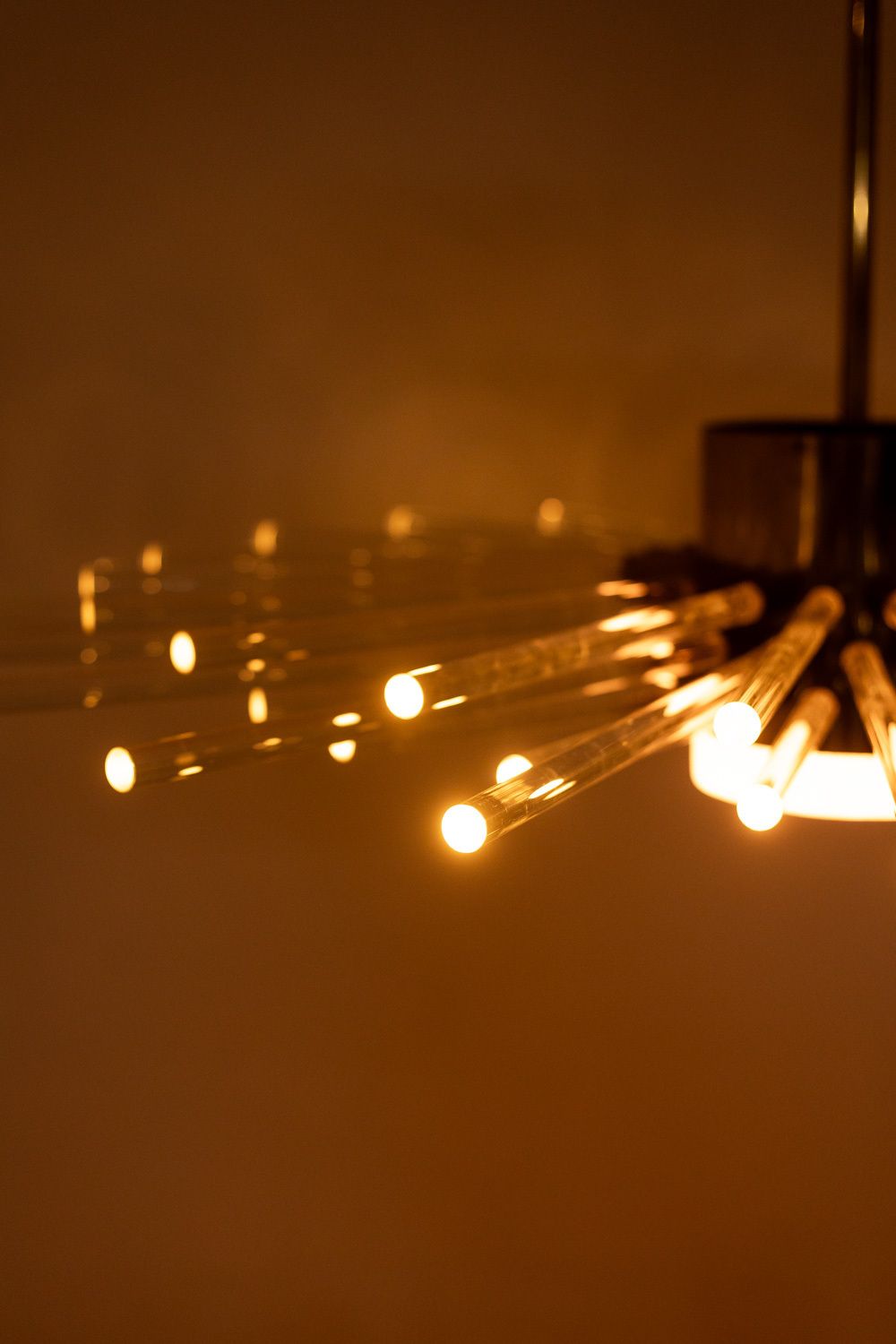Radiant Glass Tube Chandelier. Contemporary Design. photo Lighting