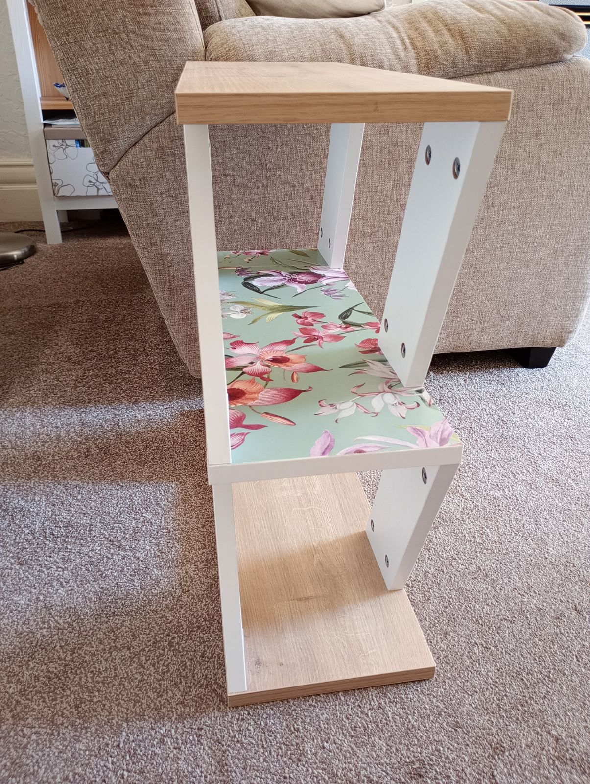 photo furniture Three Shelved White And Wood Effect Bookcase/Table With Water Colour And Jade Green Applied Paper.
