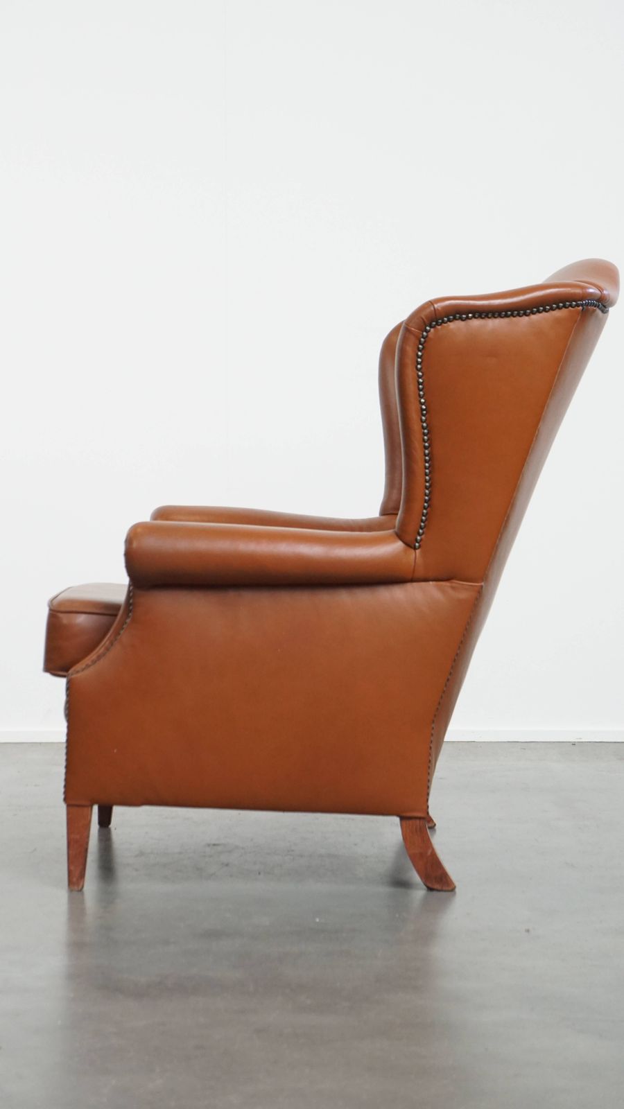 Stylish And In Good Condition Cognac Colored Cowhide Armchair In English Style With Decorative Nails photo 810.3083999999999