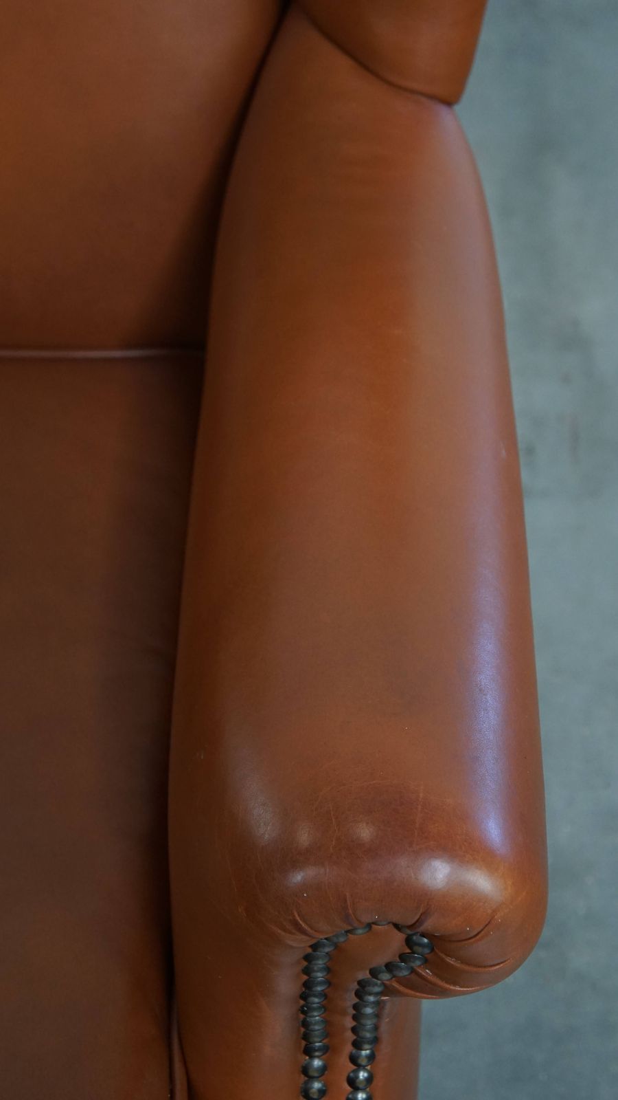 Stylish And In Good Condition Cognac Colored Cowhide Armchair In English Style With Decorative Nails photo vintage