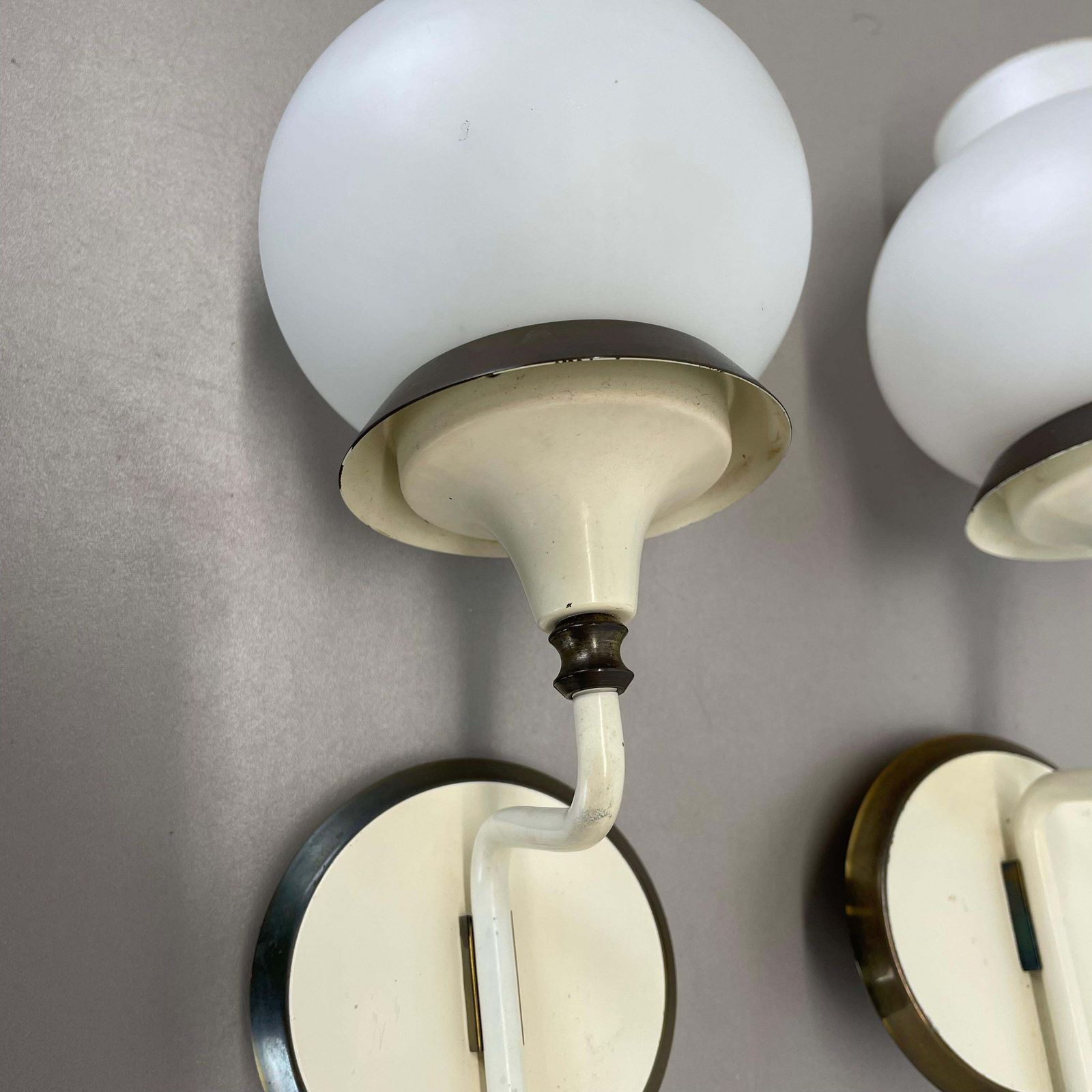 photo furniture Set Of Two Brutalist Brass And White Glass Wall Light Sconces, France 1960s