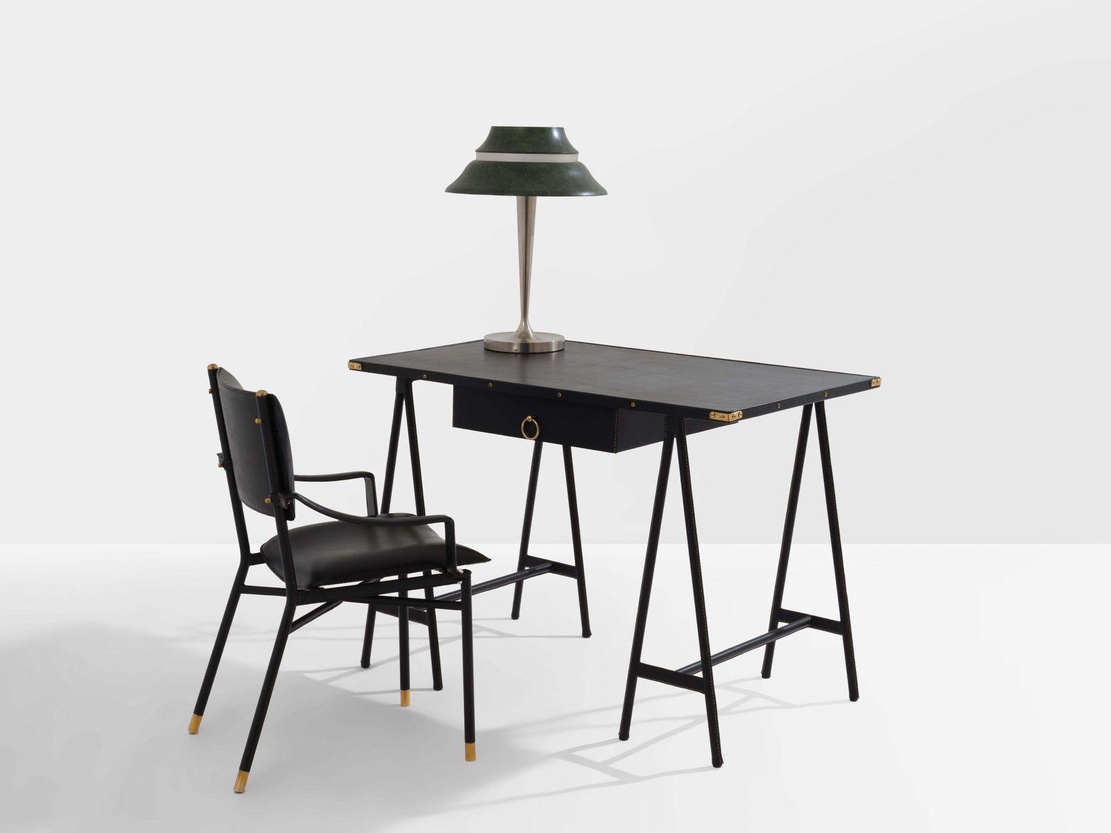 photo furniture Fauteuil de bureau Jacques Adnet en cuir sellier laiton, 1950