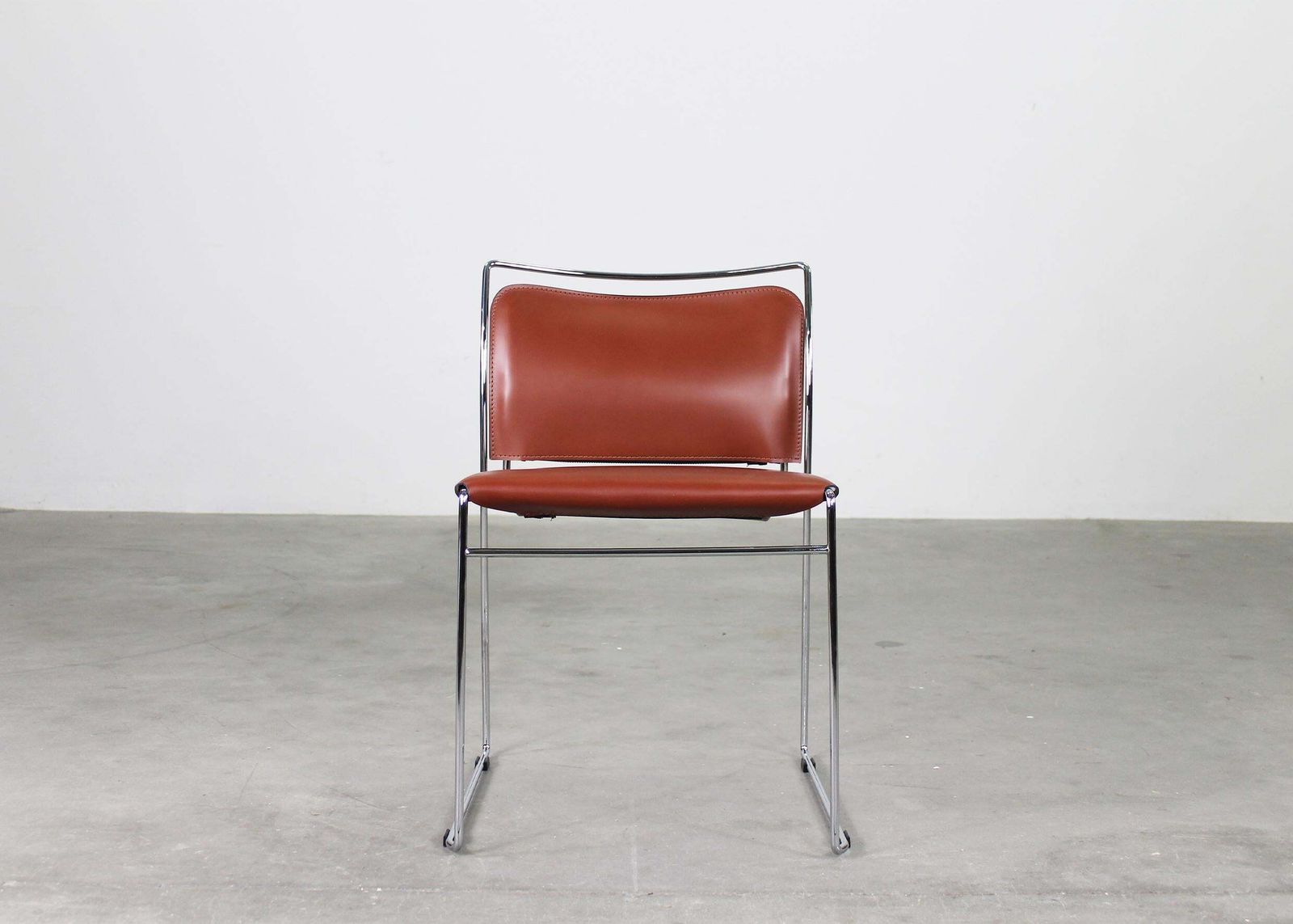 photo furniture Kazuhide Takahama Set Of Twelve Tulu Chairs In Leather And Steel By Simon Gavina