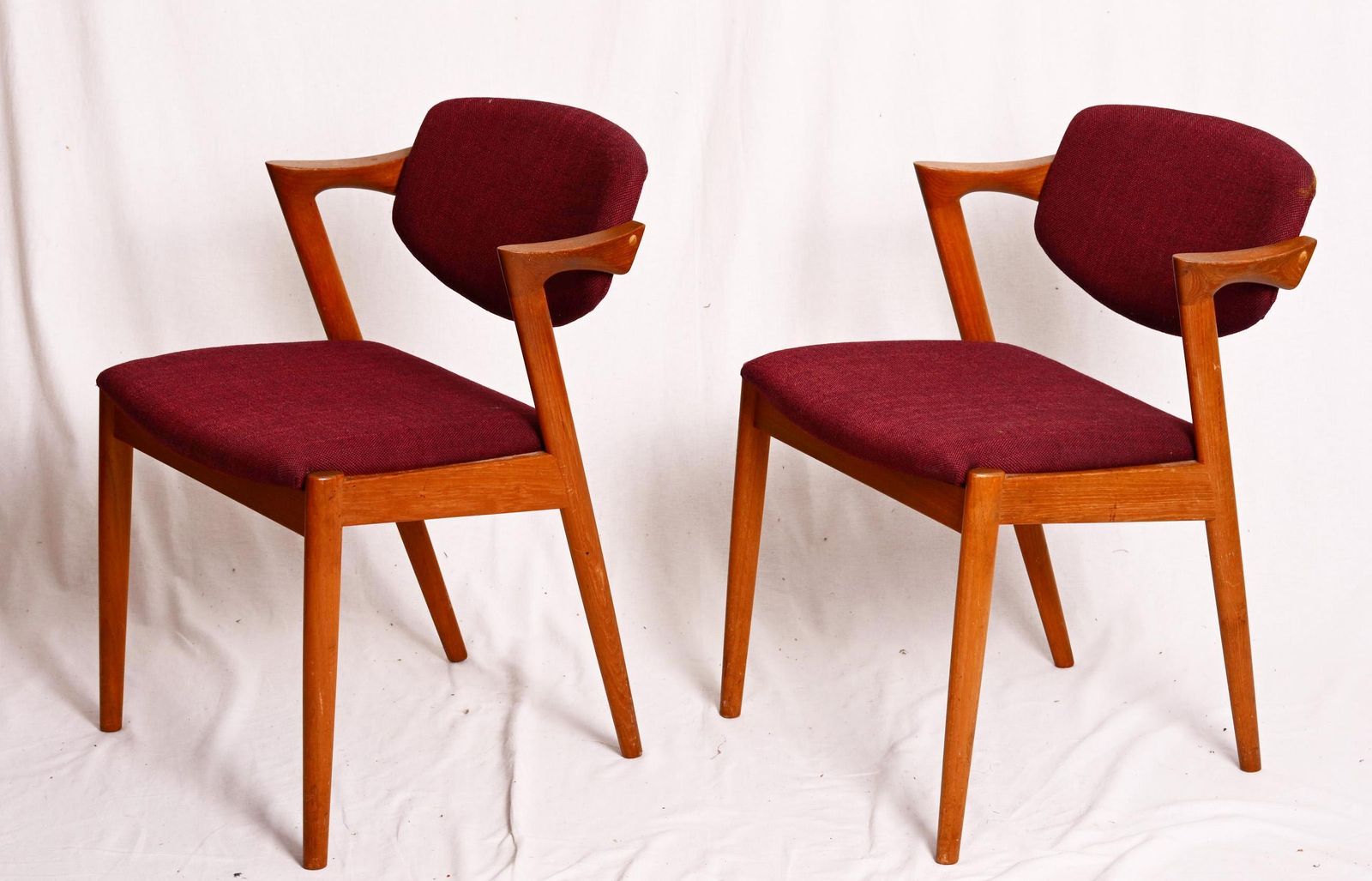 A Pair Of Teak Dining Chairs By Kai Kristiansen Model 42 photo furniture
