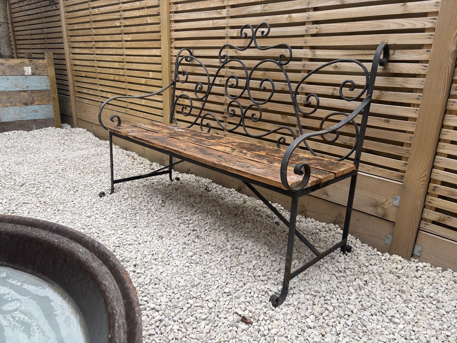 French Wrought Iron Garden Bench With Weathered Wooden Seat photo 625.0