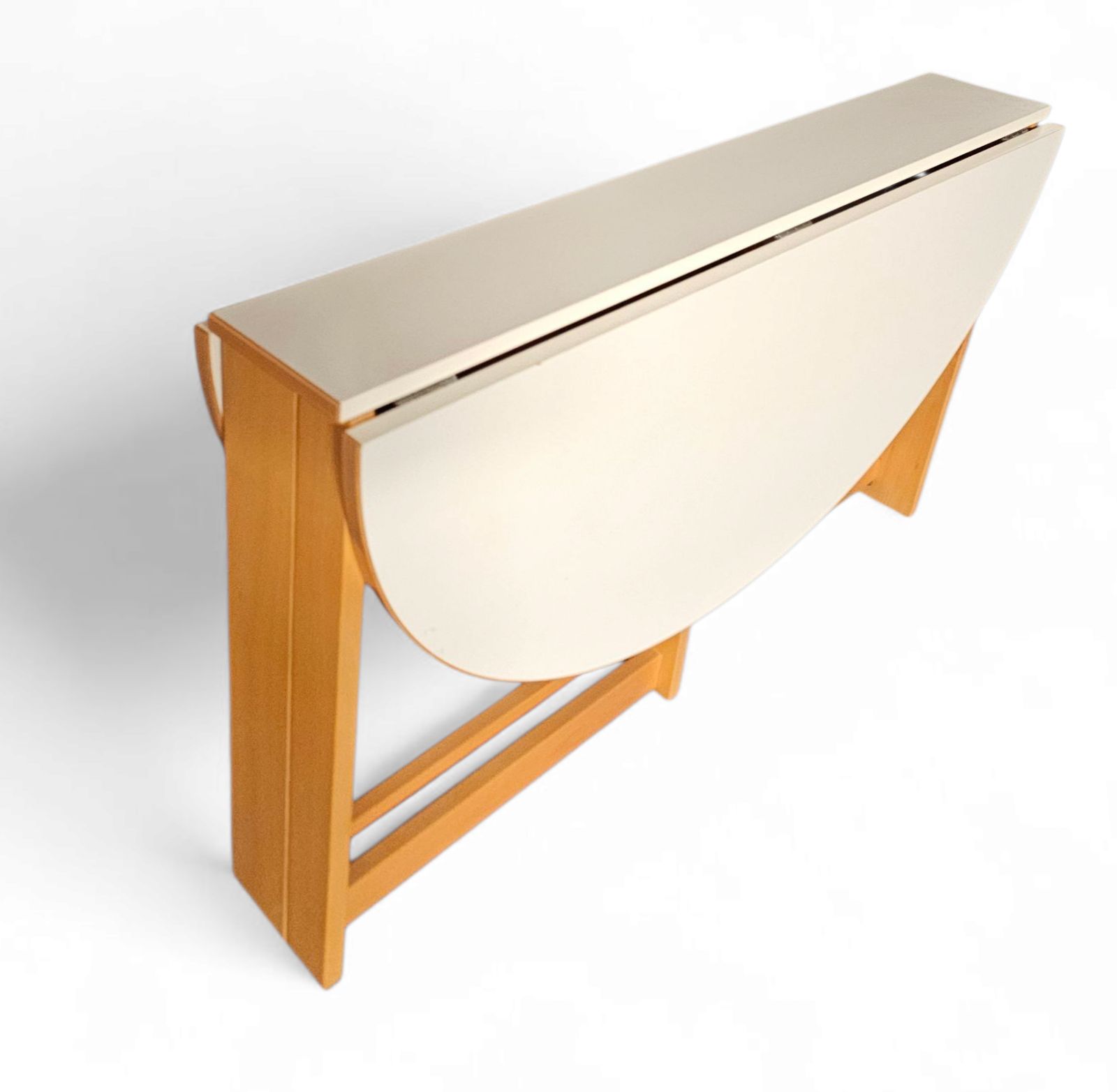Vintage Scandinavian Folding Dining Table With Side Leaves. The Oval Top Is Made Of White Formica photo vintage