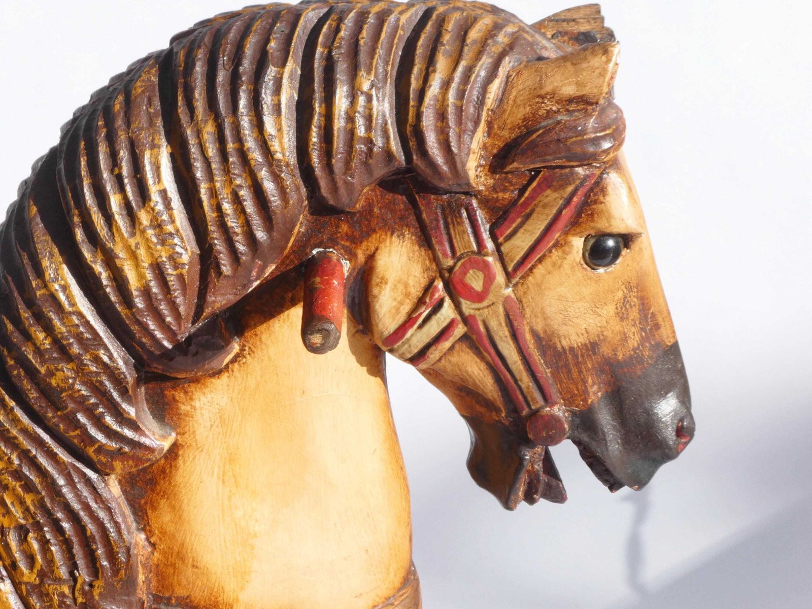 Wood Carved Rocking Horse With Glass Eyes, Carousel Horse With Floral Painted Details, Old Animal Toy On Wheels, Art Object photo vintage