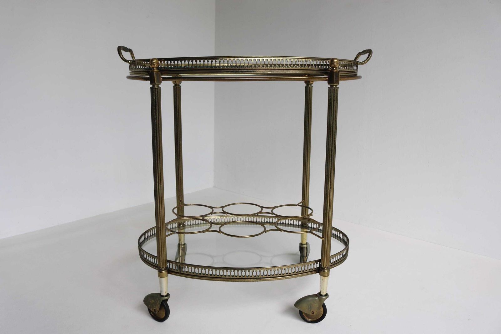 Vintage Gilt Metal Oval Bar Cart Hollywood Regency Glass Trolley Removable Tray & Bottle Rack In The Style Of Maison Jansen France Ca. 1940s photo vintage