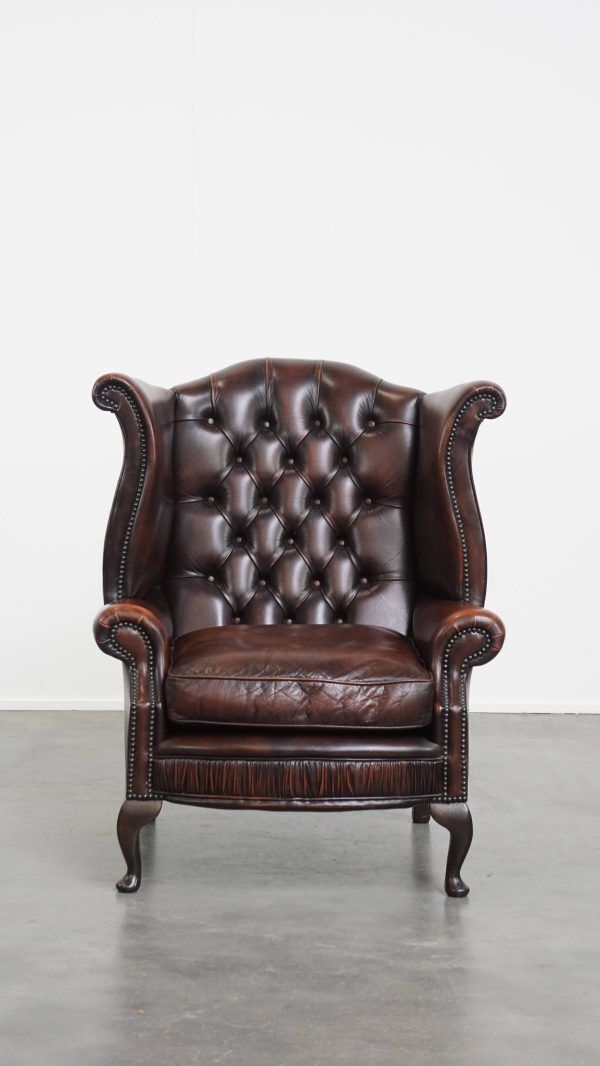 Luxurious, Warm Colored, Brown Cowhide Chesterfield Wingback Armchair With Unique Details photo furniture
