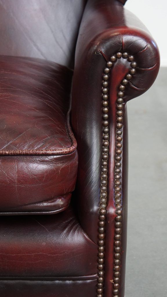 photo for sale Charming And Comfortable Burgundy Red Cowhide Wing Chair In English Style With A Beautiful Patina