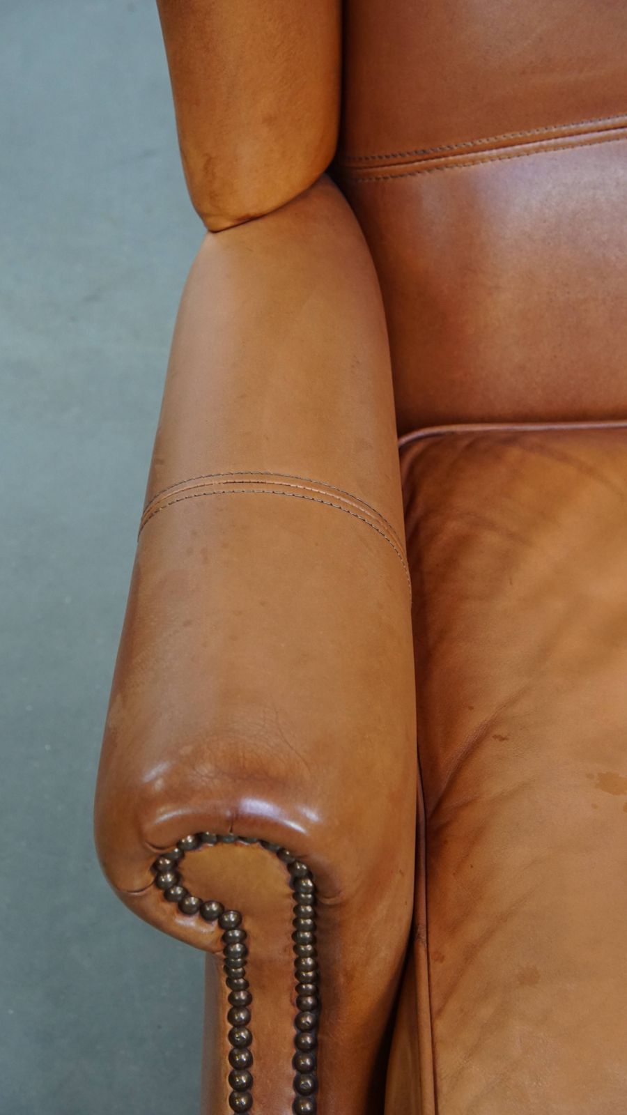 Classic And Unique Cowhide Wing Chair Finished With Decorative Nails And Beautiful Details photo buy