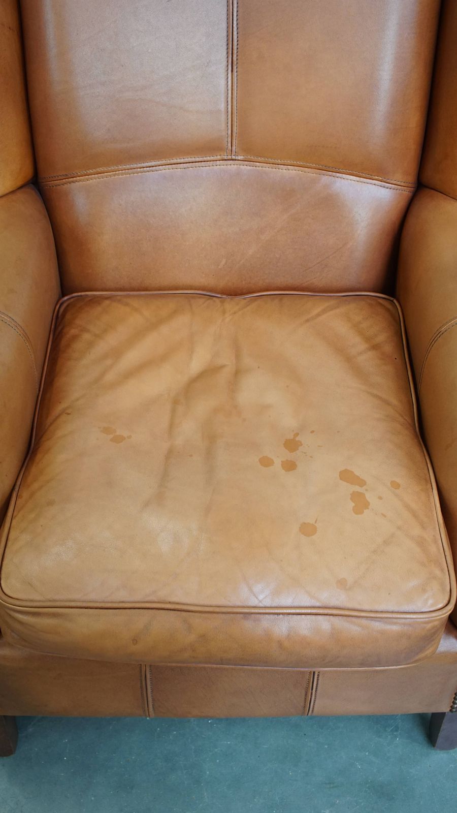 Classic And Unique Set Of 2 Cowhide Wing Chairs Finished With Decorative Nails And Beautiful Details photo vinterior
