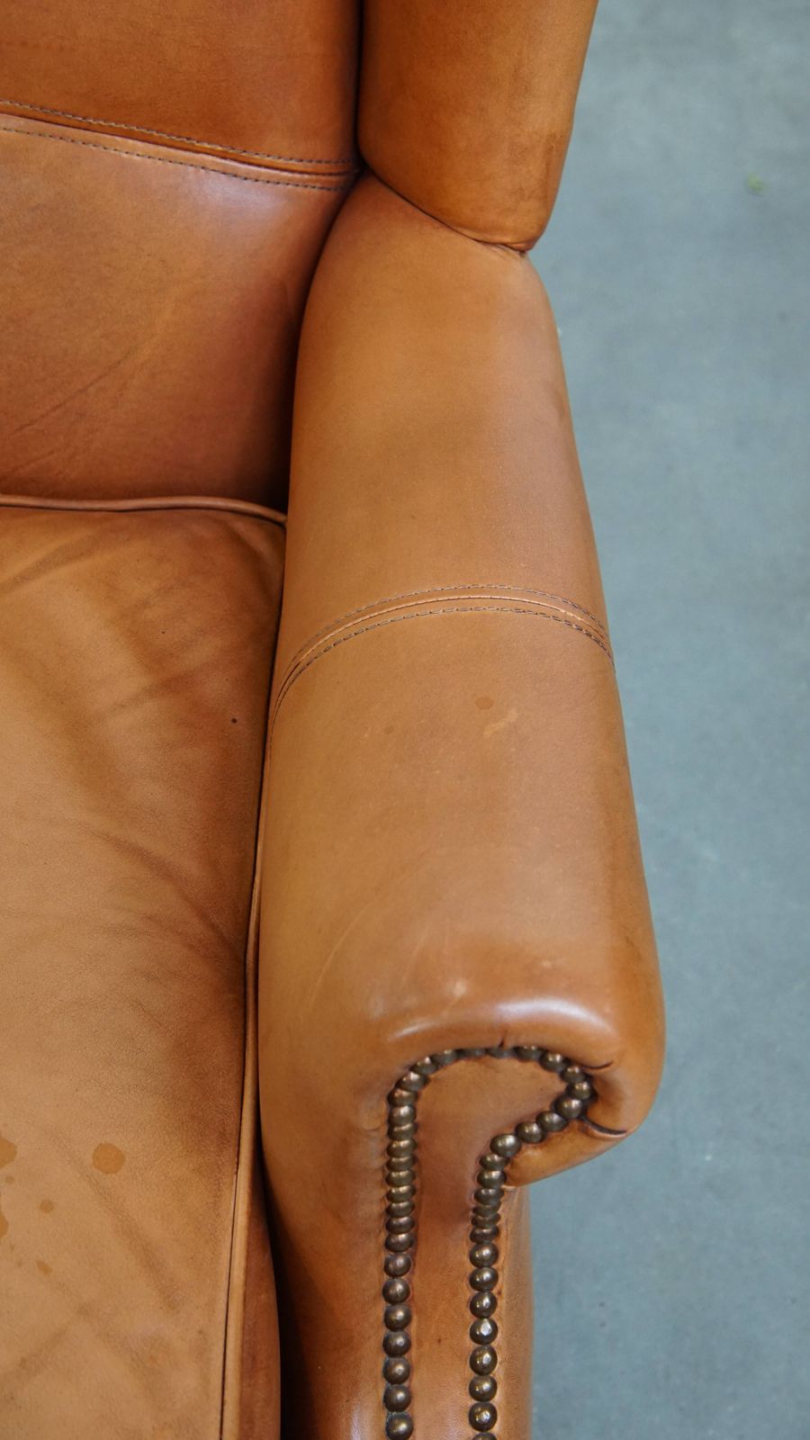 photo furniture Classic And Unique Set Of 2 Cowhide Wing Chairs Finished With Decorative Nails And Beautiful Details