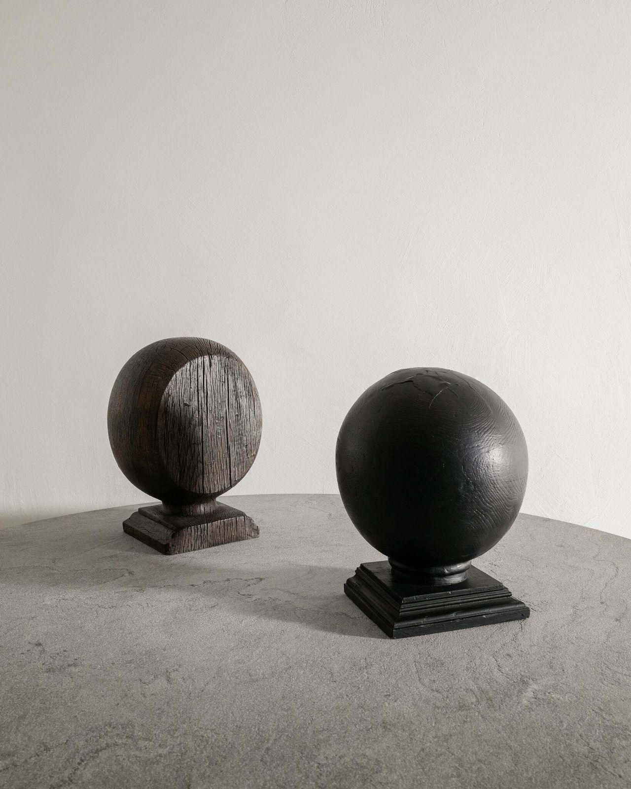 Pair Of English Antique Wooden Globe Sculptures In Black & Brown Stained Oak Produced In England