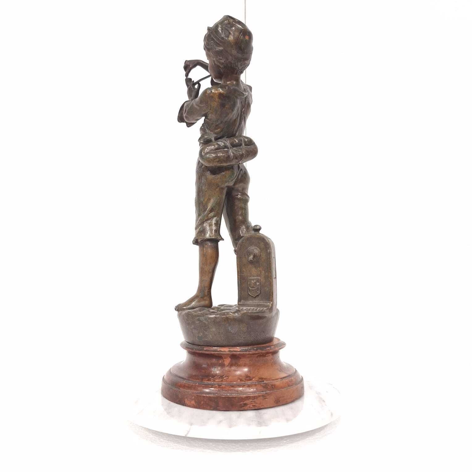 A French Spelter Statue Of A Boy Lighting A Pipe photo buy